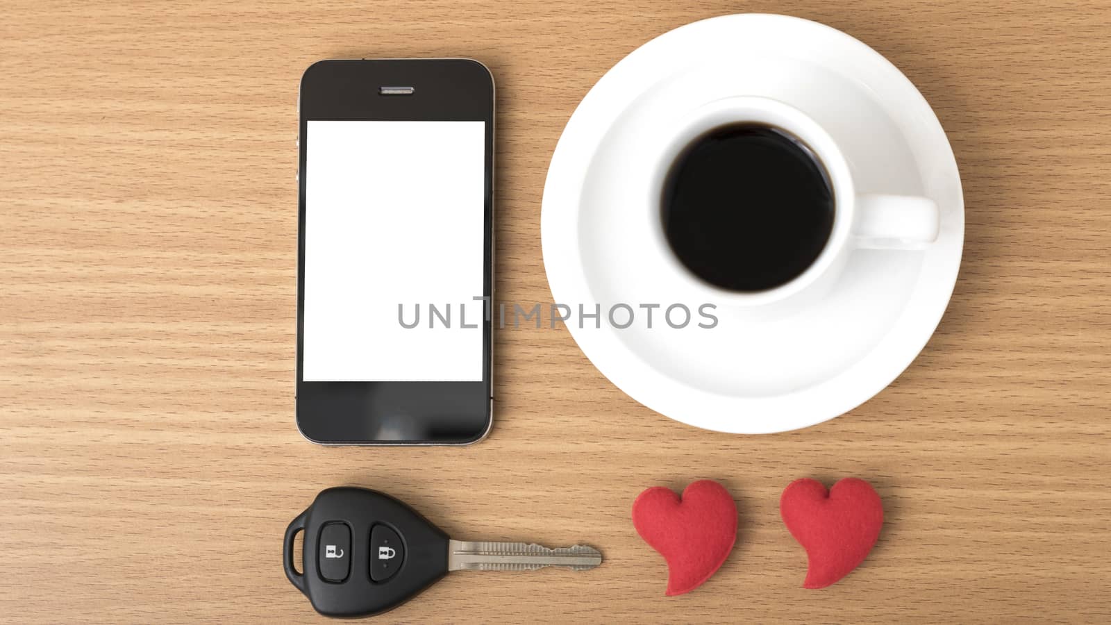 coffee phone car key and heart on wood table background