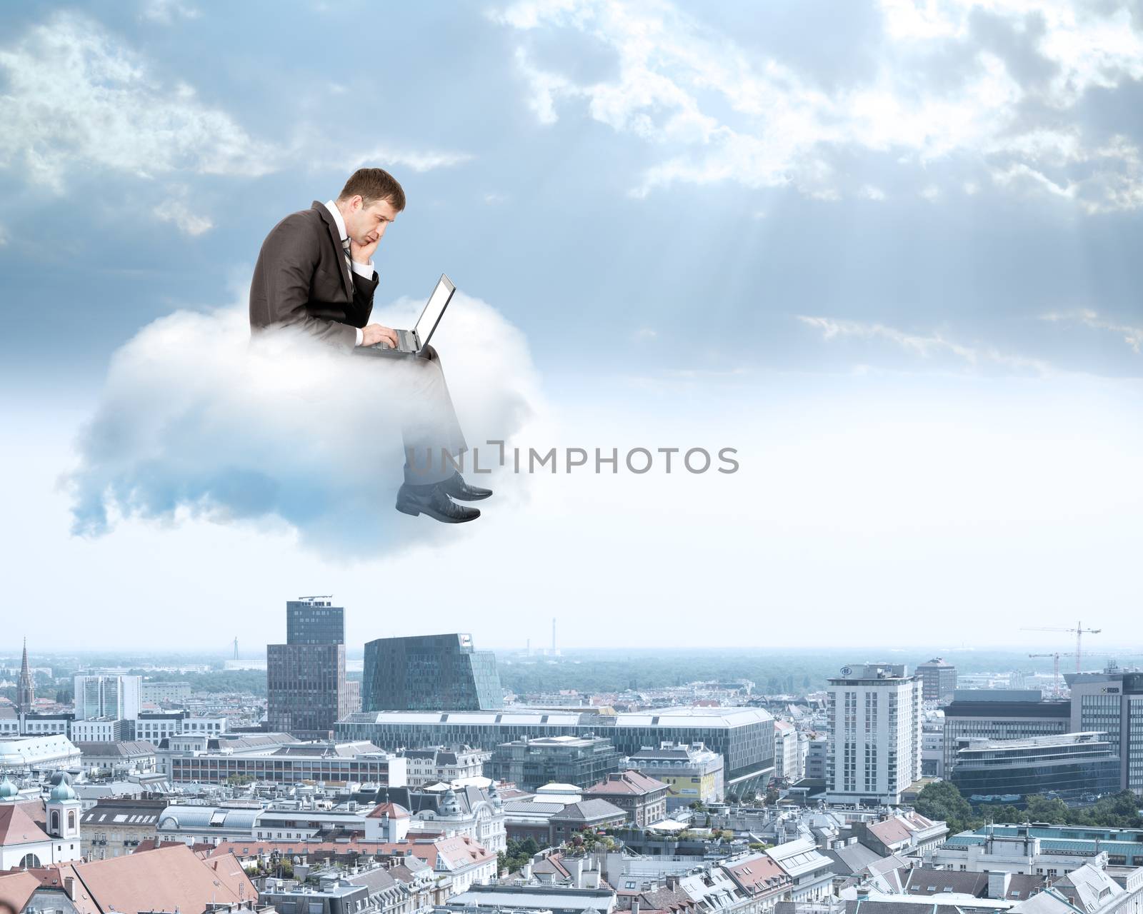 Businessman working on laptop by cherezoff