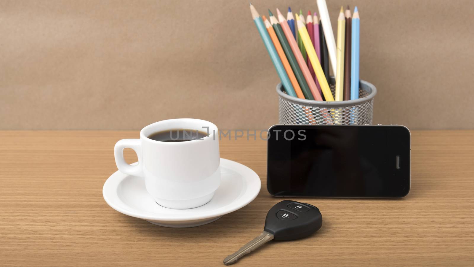 coffee,phone,car key and heart on wood table background