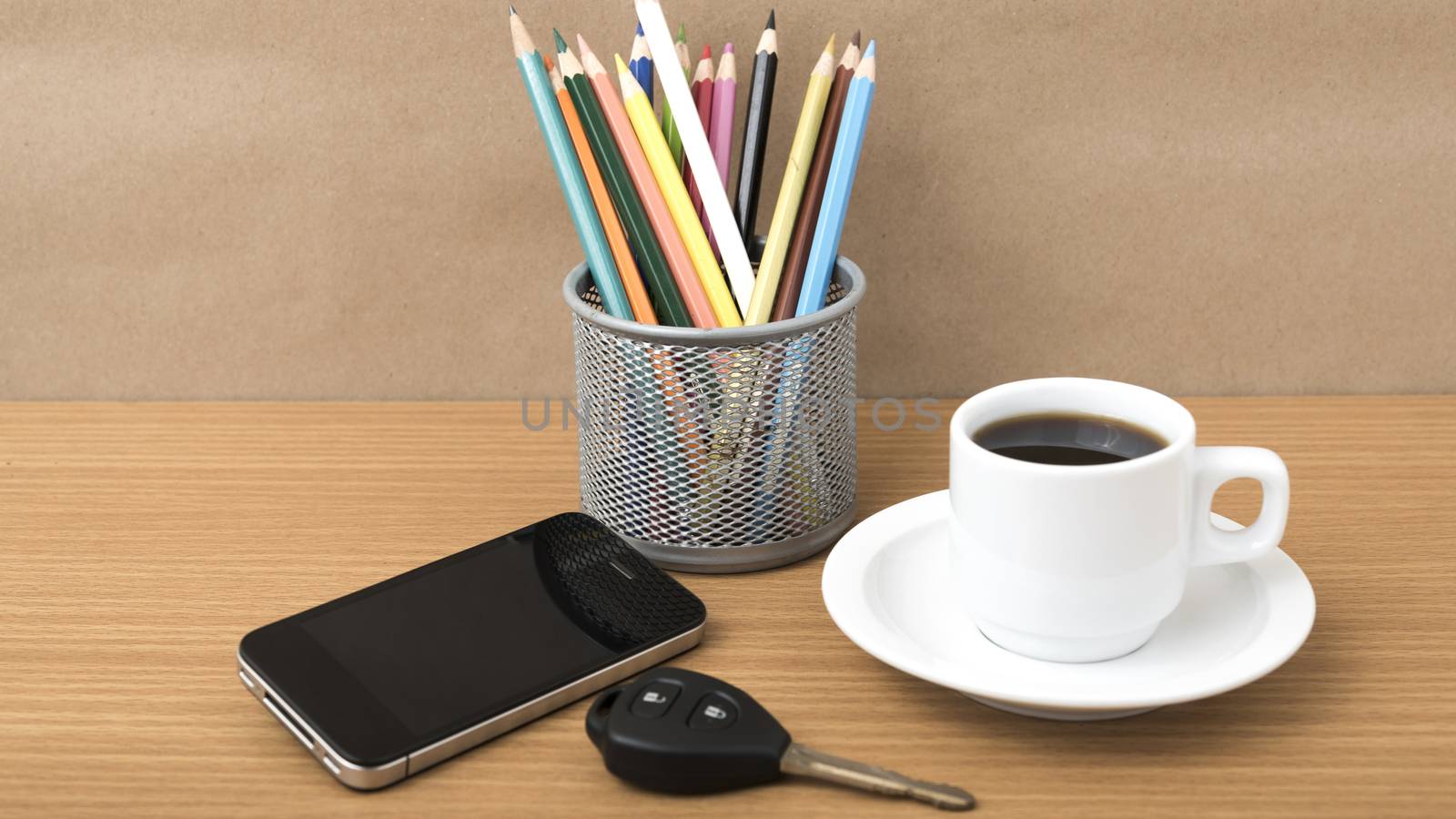 coffee,phone,car key and heart on wood table background