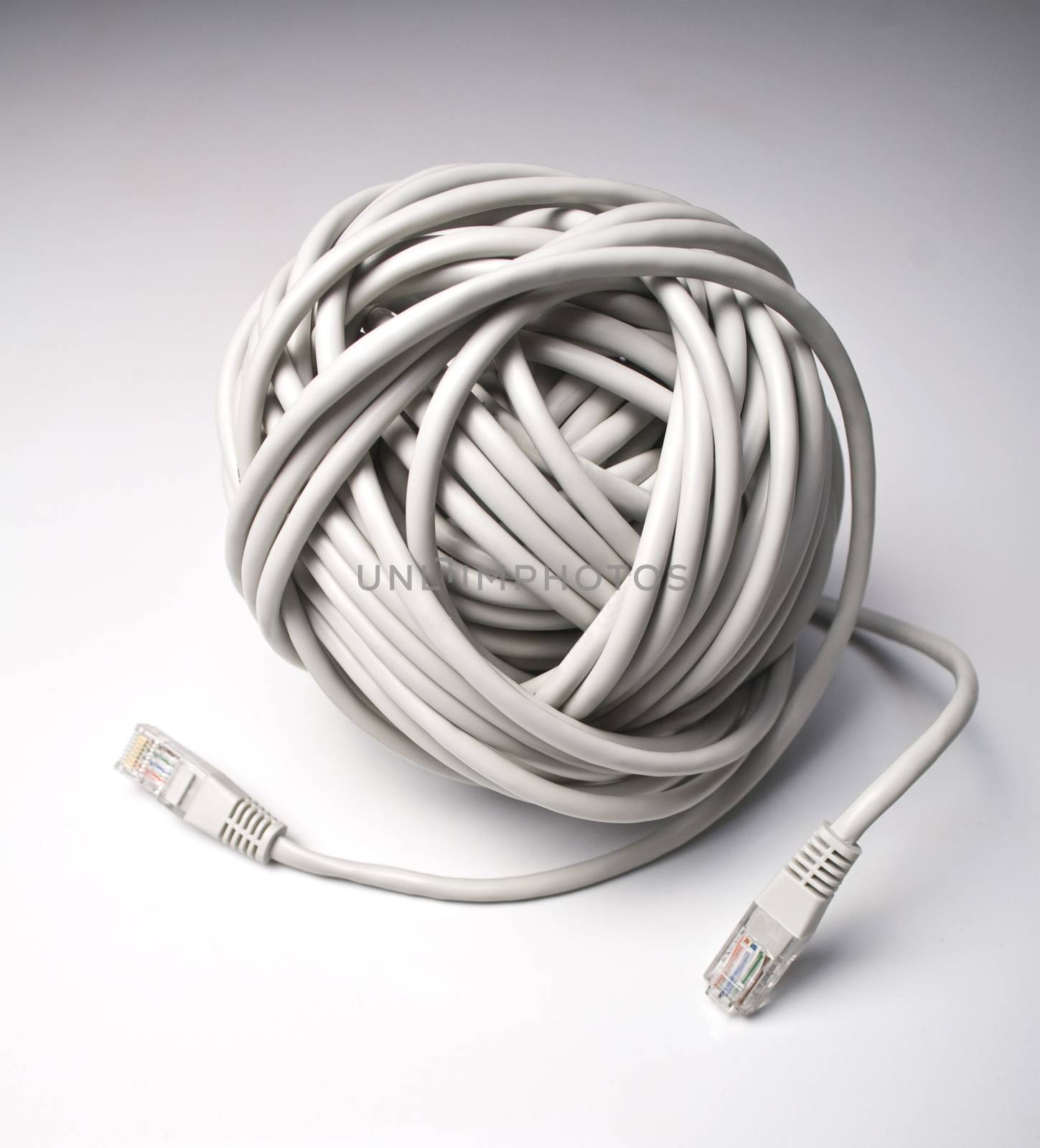 Rolled computer cables on grey background indicating a network problem