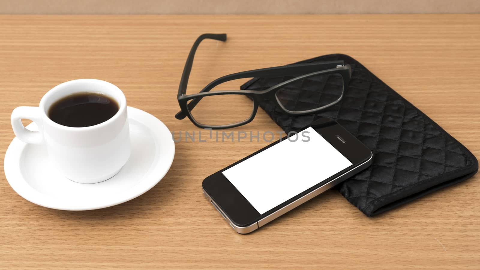 coffee,phone,eyeglasses and wallet on wood table background