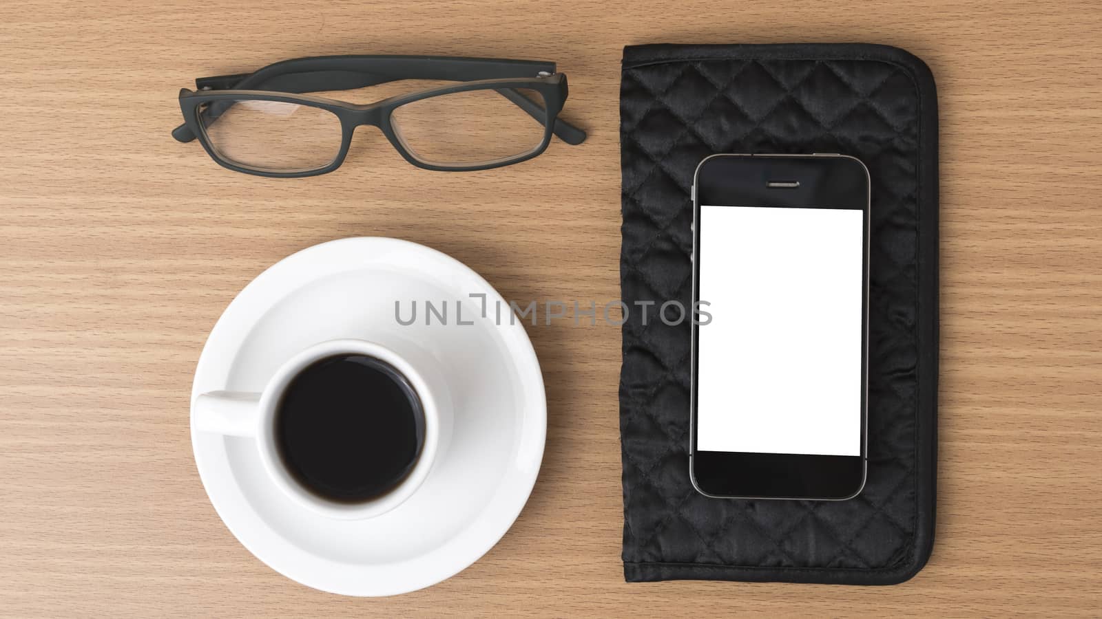 coffee,phone,eyeglasses and wallet on wood table background