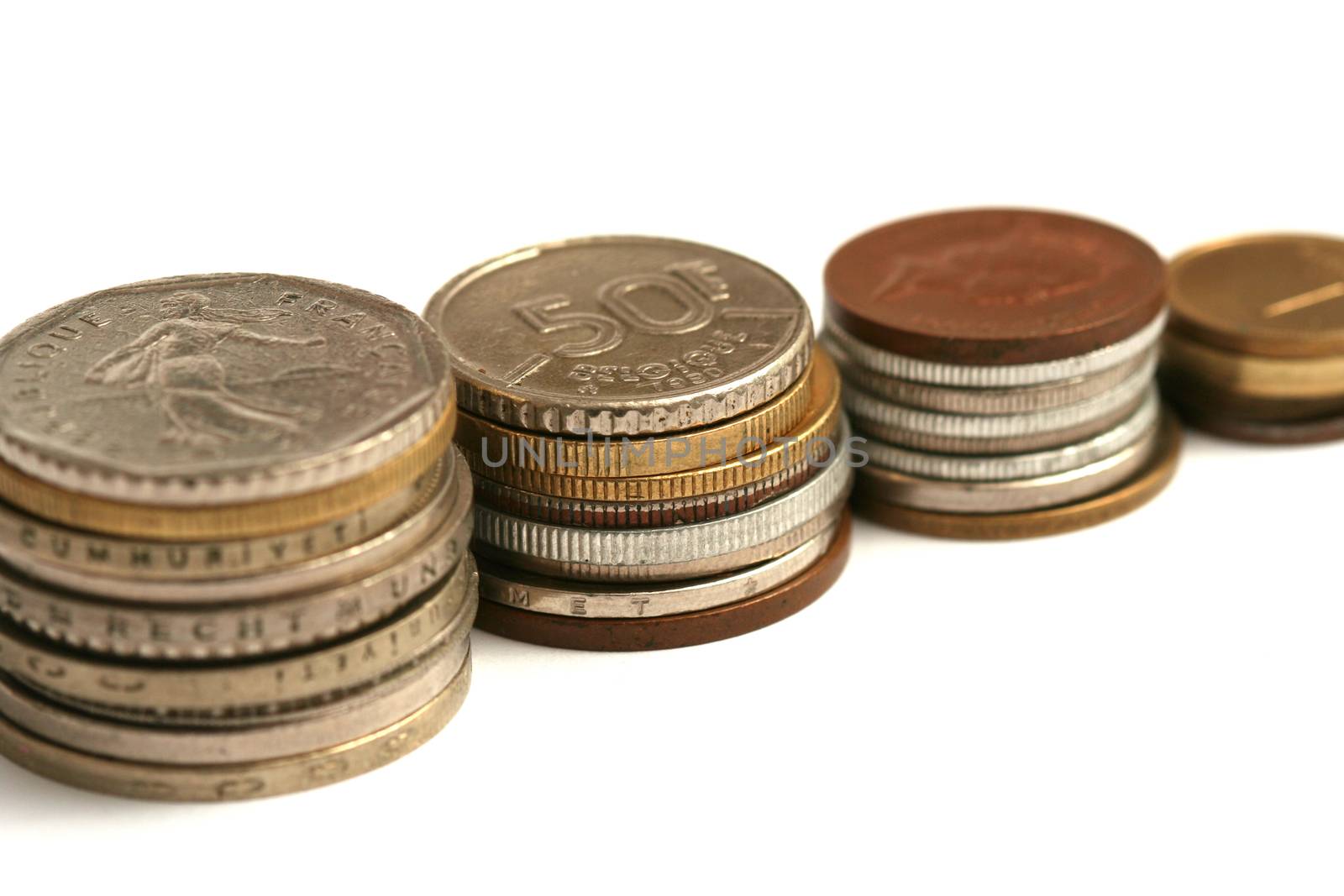 Old European coins of different currency on white background