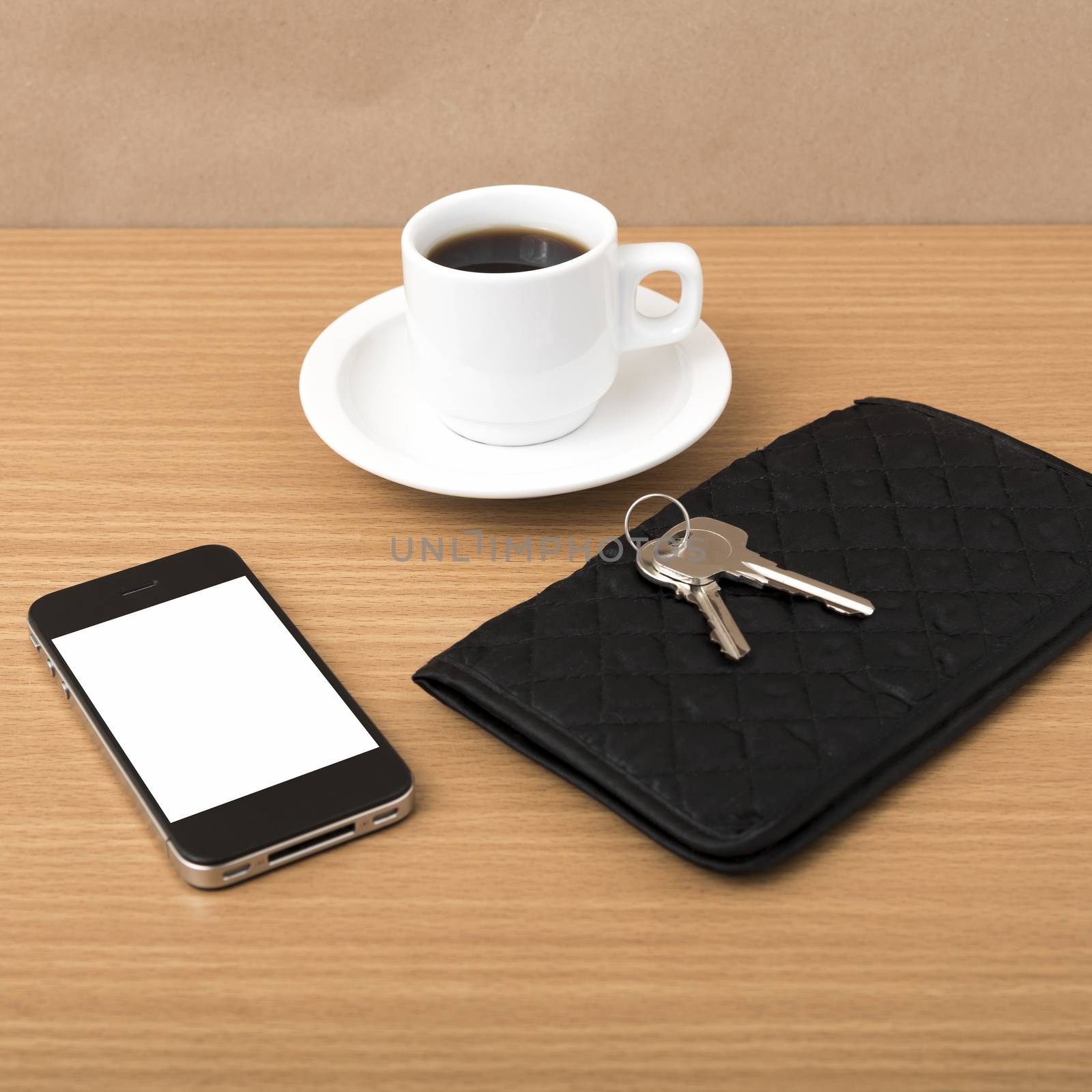coffee phone key and wallet on wood table background