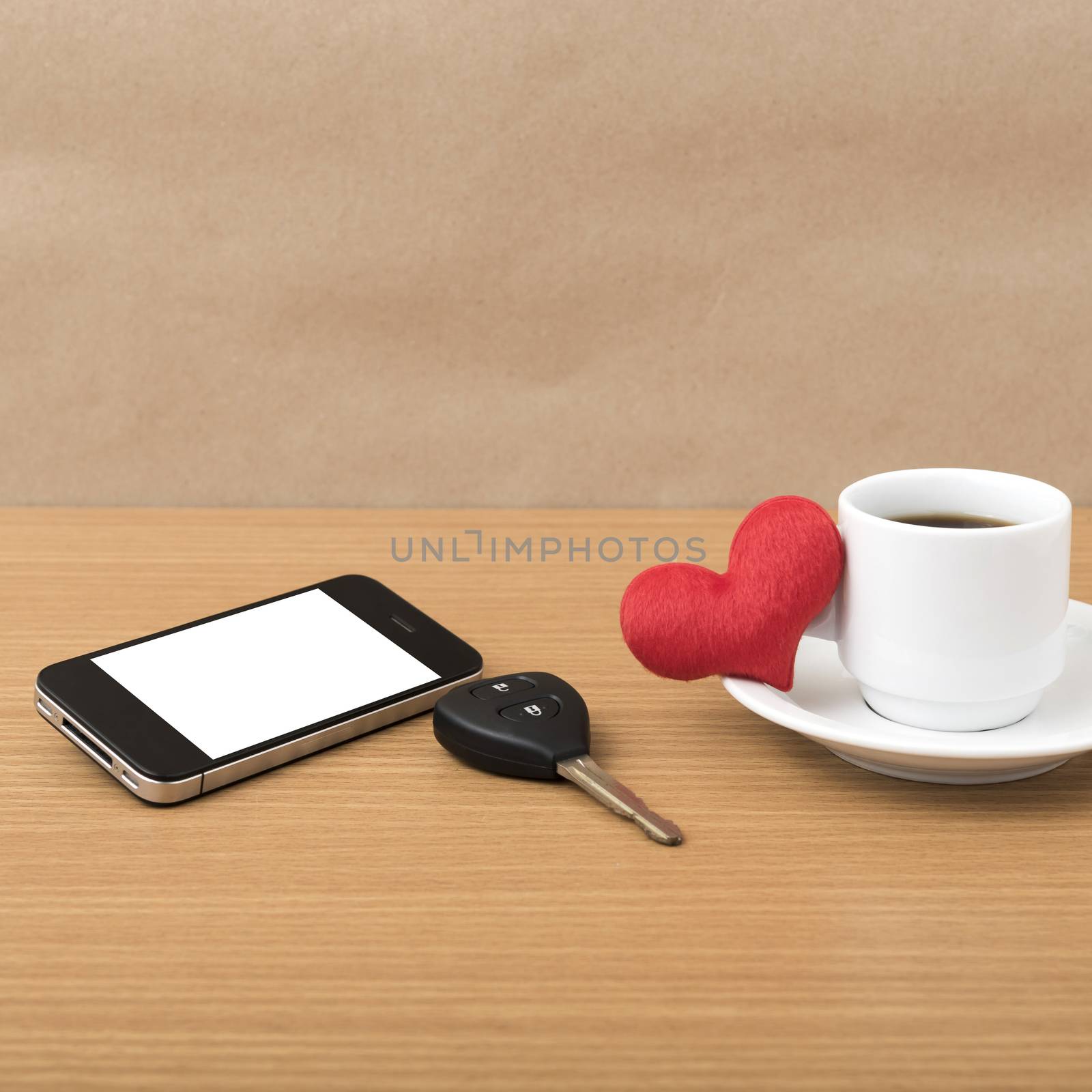 coffee phone car key and heart on wood table background