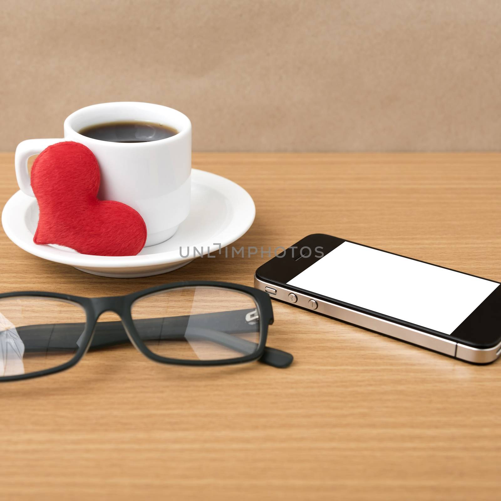 coffee,phone,eyeglasses and heart on wood table background