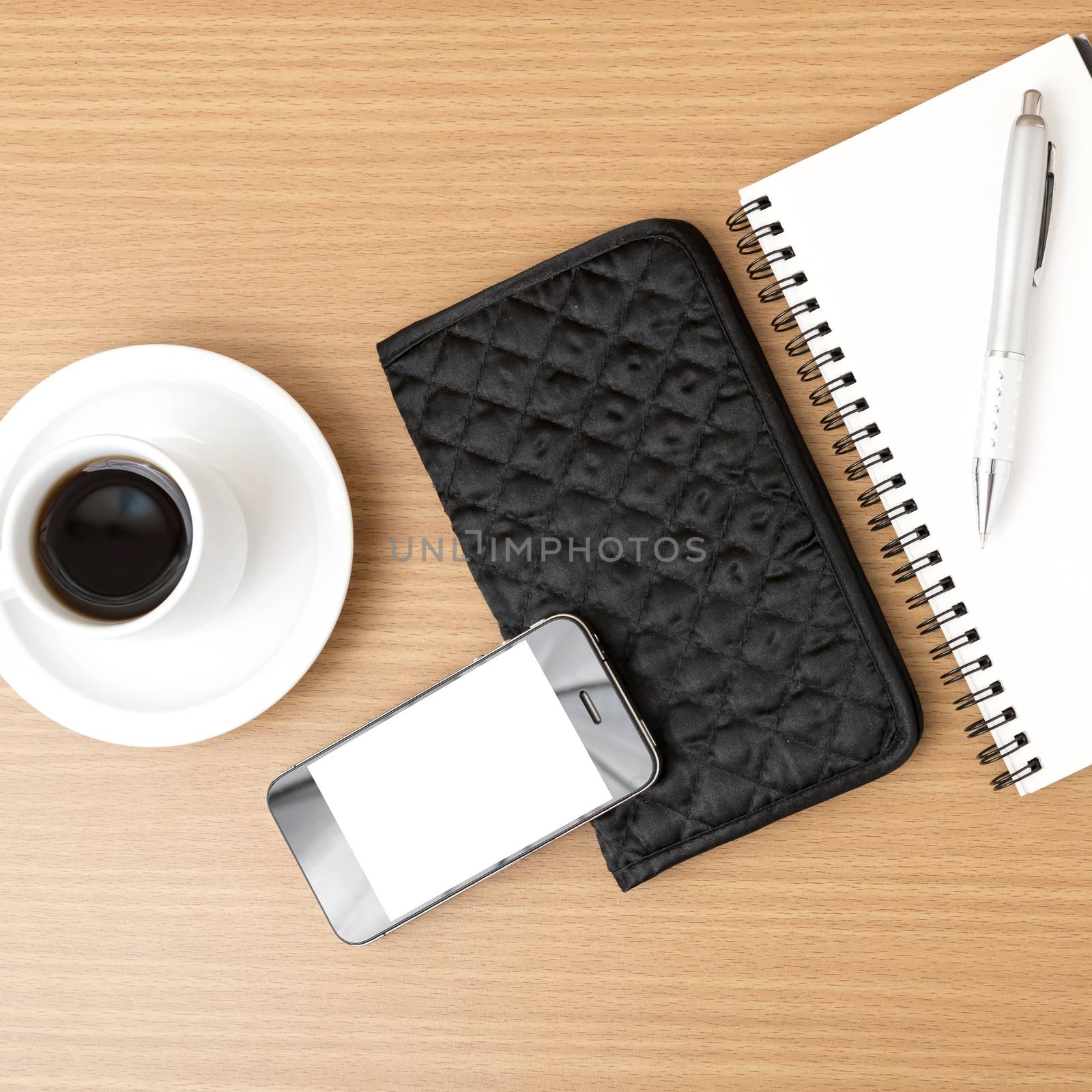 coffee,phone,notepad and wallet on wood table background