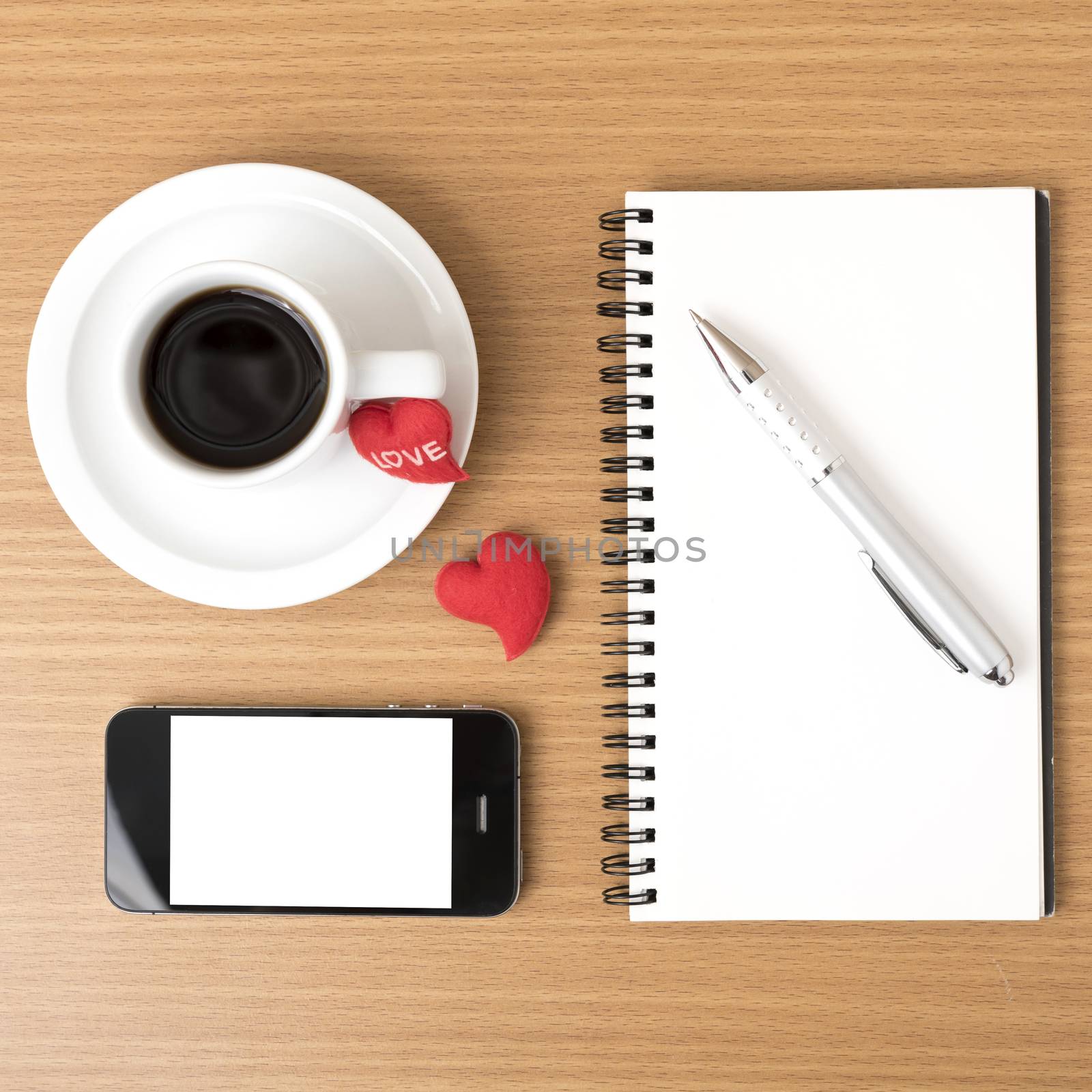 coffee,phone,notepad and heart on wood table background