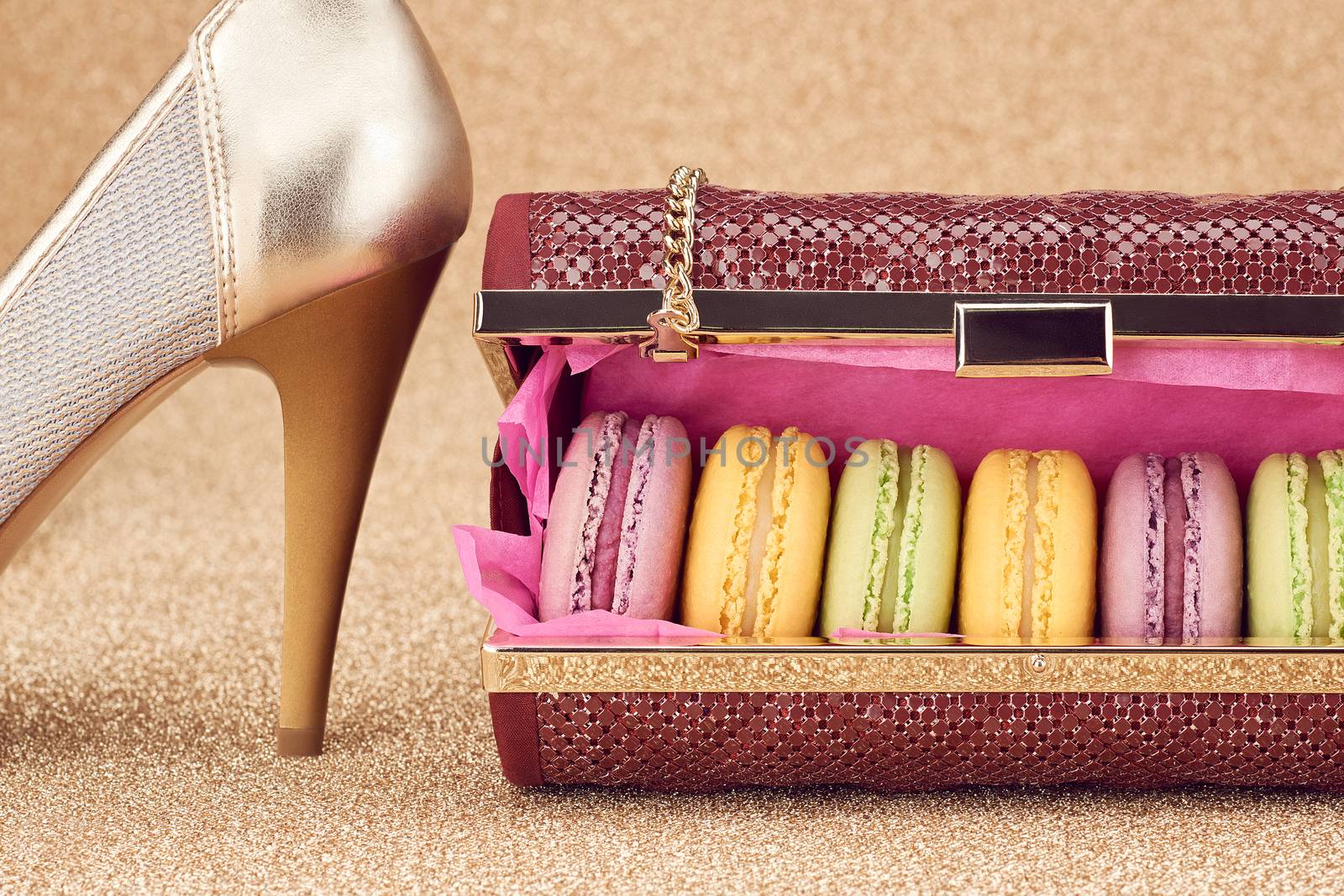 Macarons in fashion handbag, heels on gold.Vintage by 918