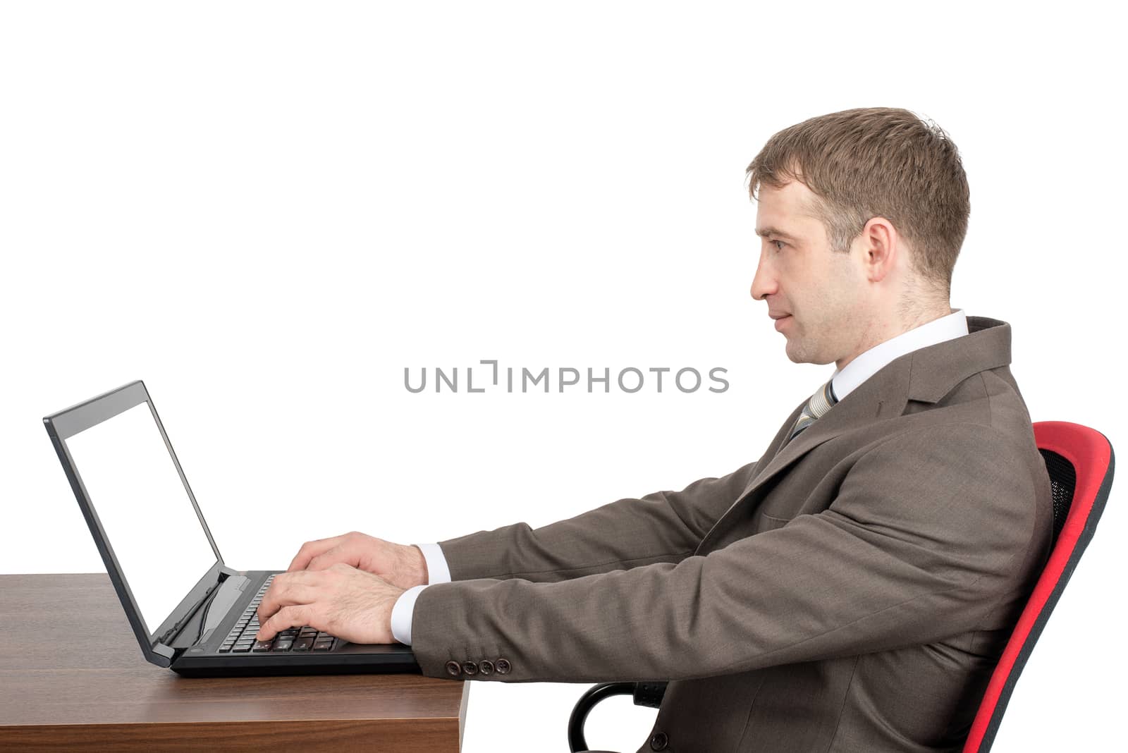 Businessman working on laptop with blank screen isolated on white background, side view