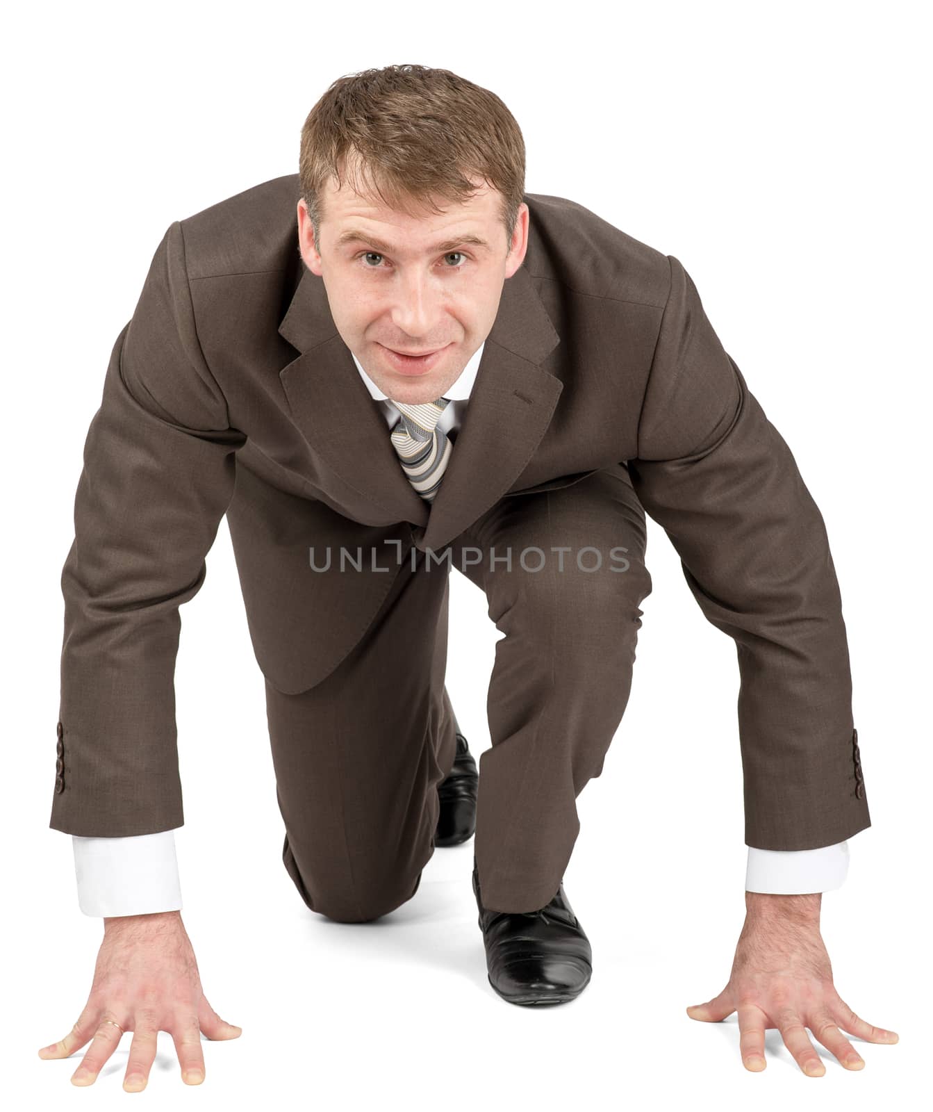 Smiling businessman starting to race isolated on white background