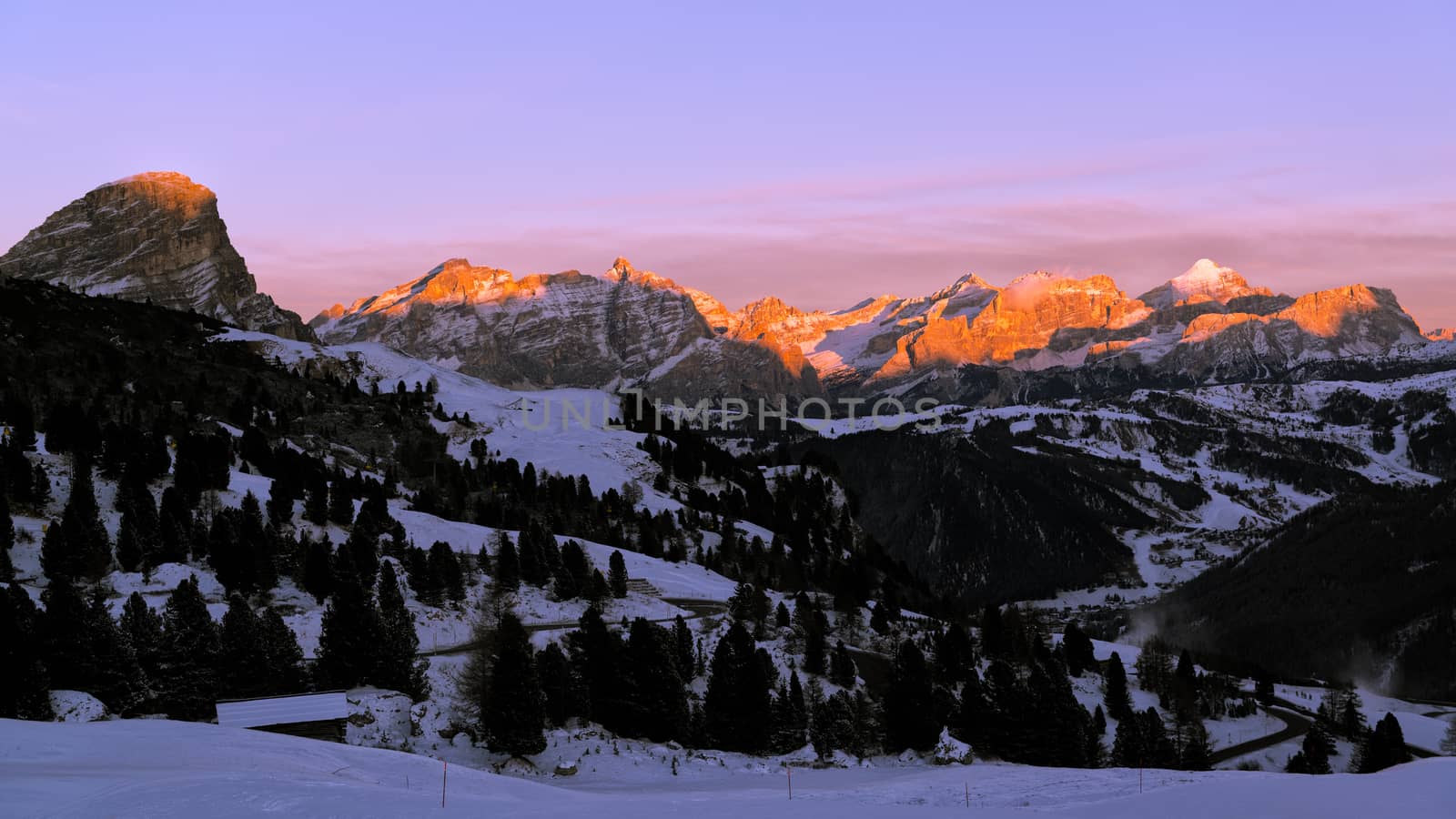 last sunny lights of the day in a romantic sunset over the mountains of Alta Badia, Trentino-Alto Adige - Italy