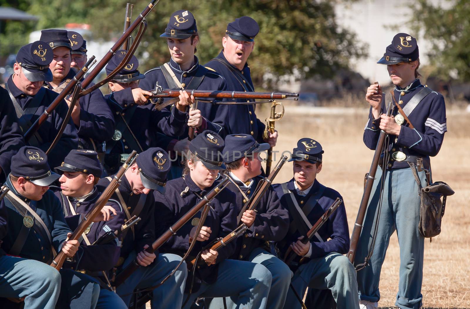 Anderson, California, United States-September 27, 2014: Members of the Union's 72nd New York prepare weapons  during a Civil War reenactment.