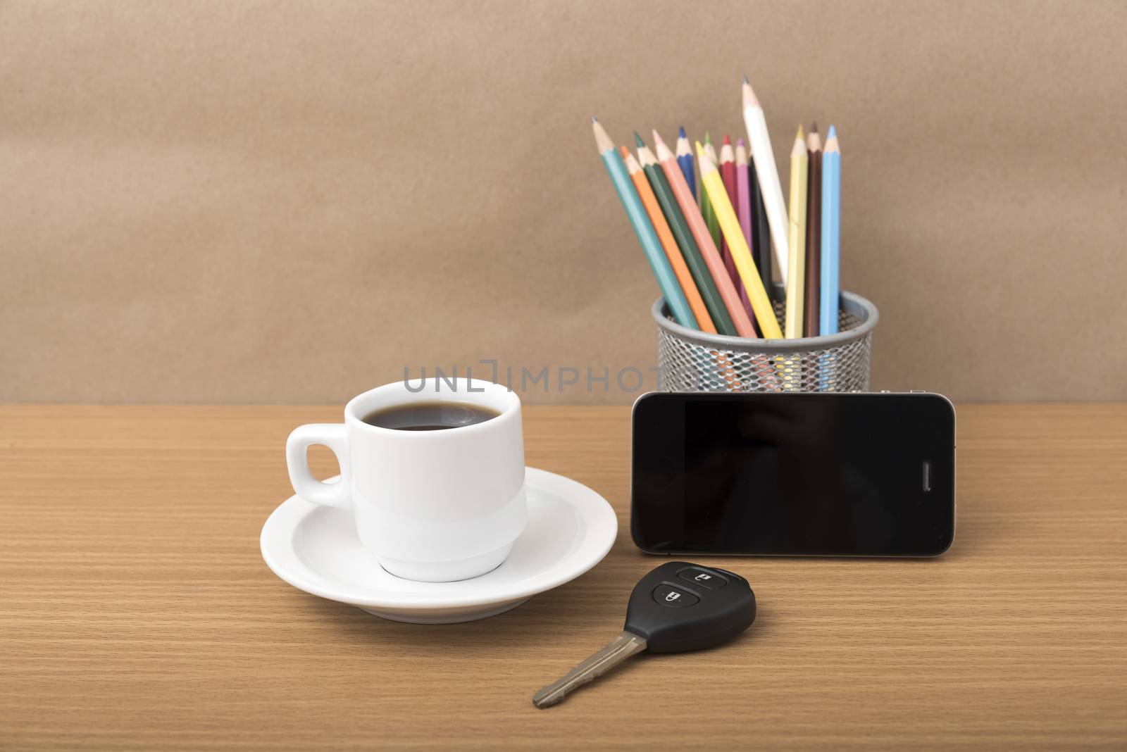 coffee,phone,car key and heart on wood table background