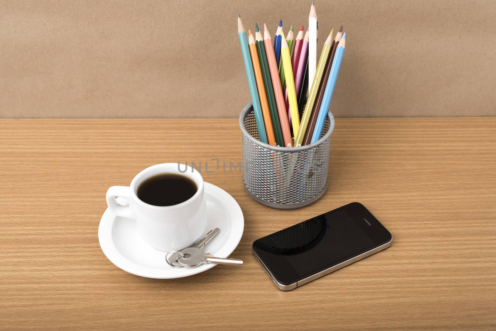 coffee,phone,key and pencil on wood table background