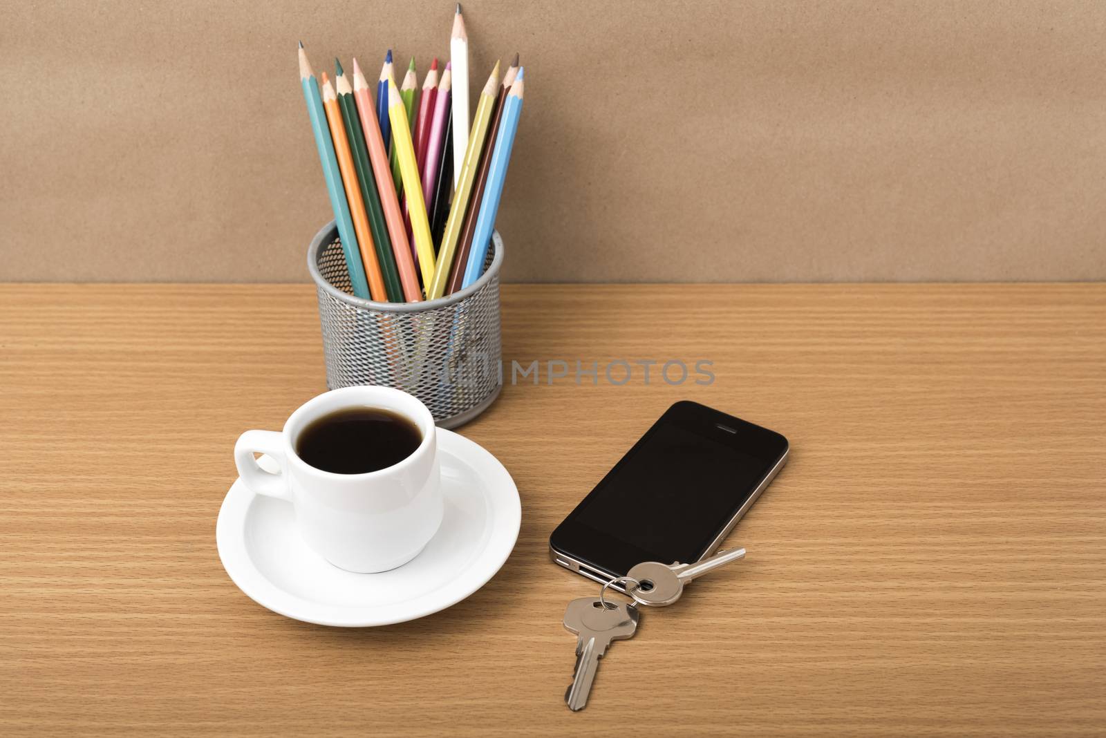 coffee,phone,key and pencil on wood table background
