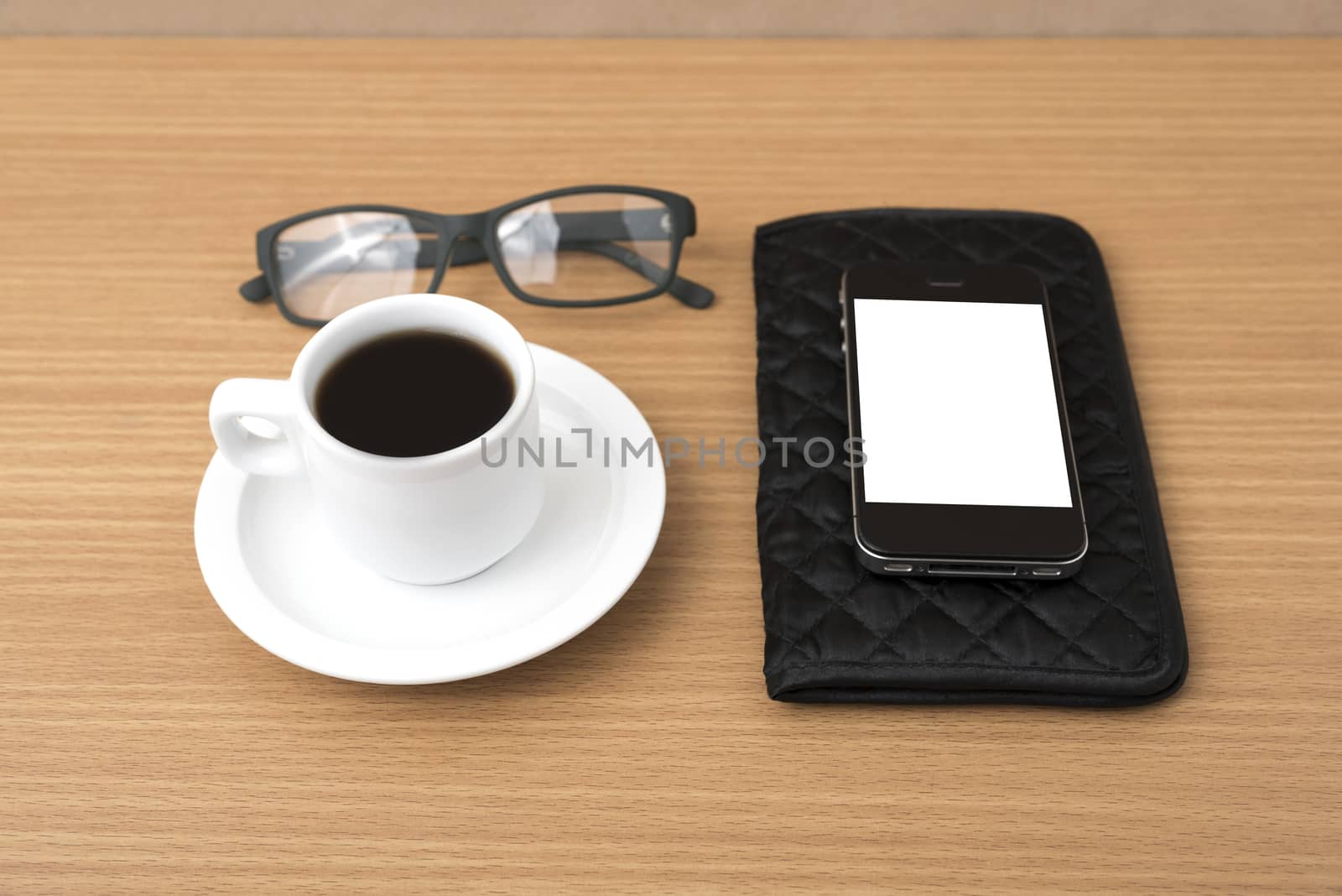 coffee,phone,eyeglasses and wallet on wood table background
