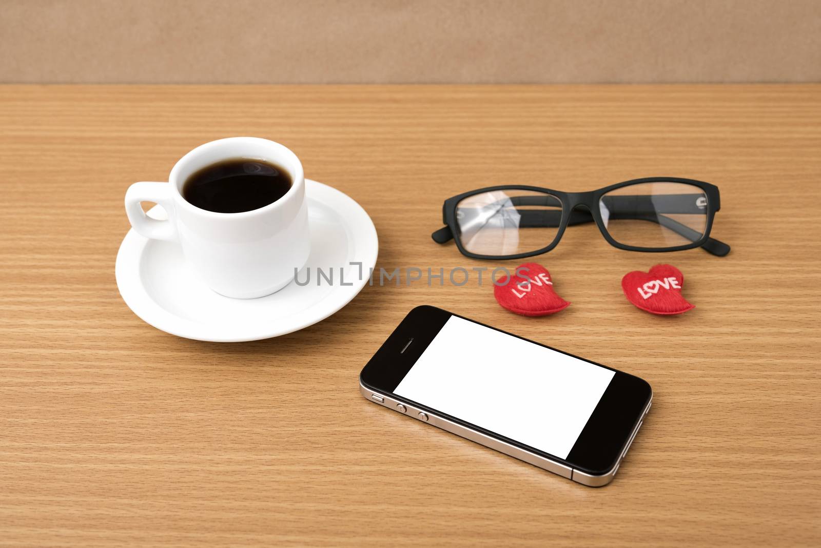 coffee,phone,eyeglasses and heart on wood table background