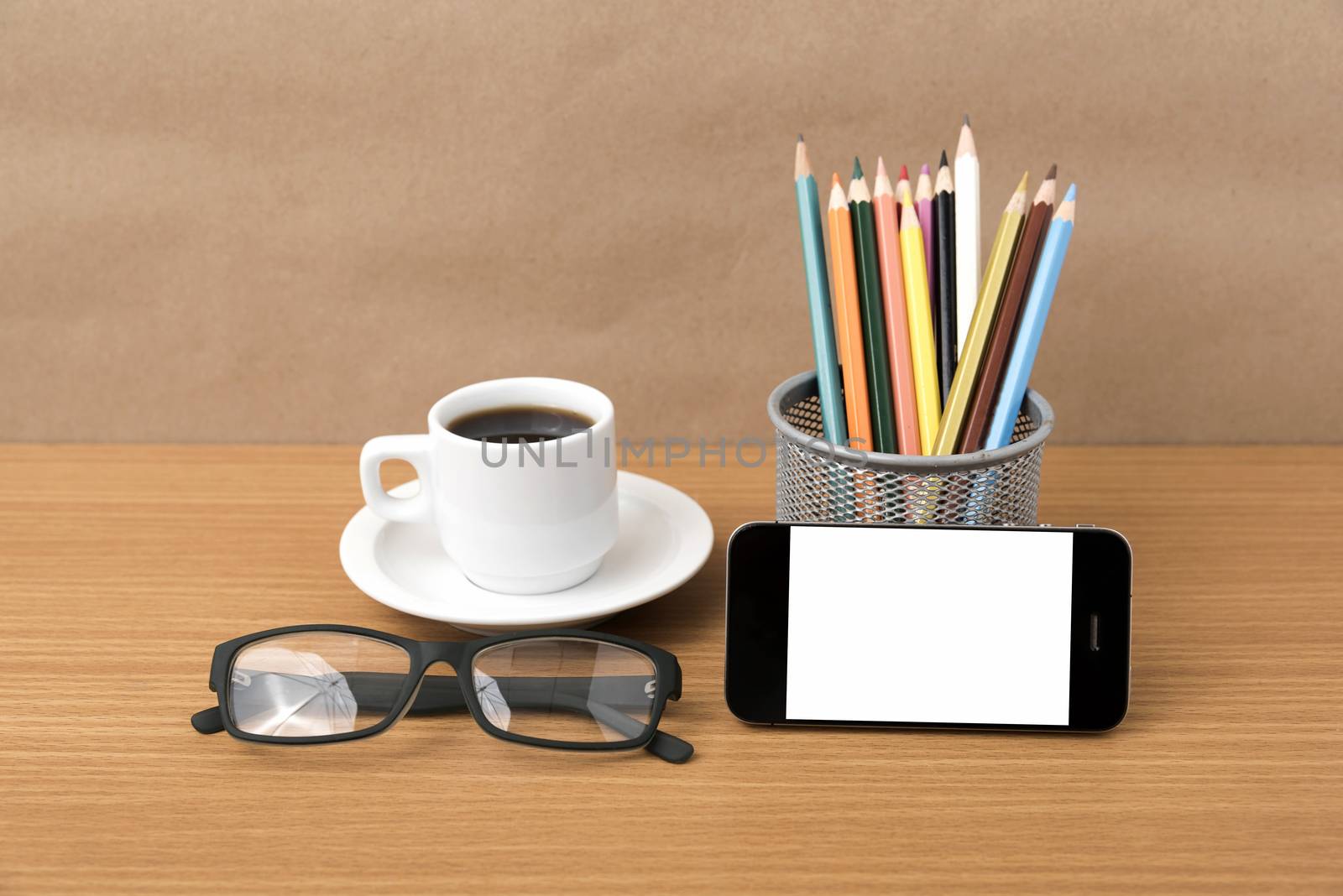coffee,phone,eyeglasses and pencil on wood table background