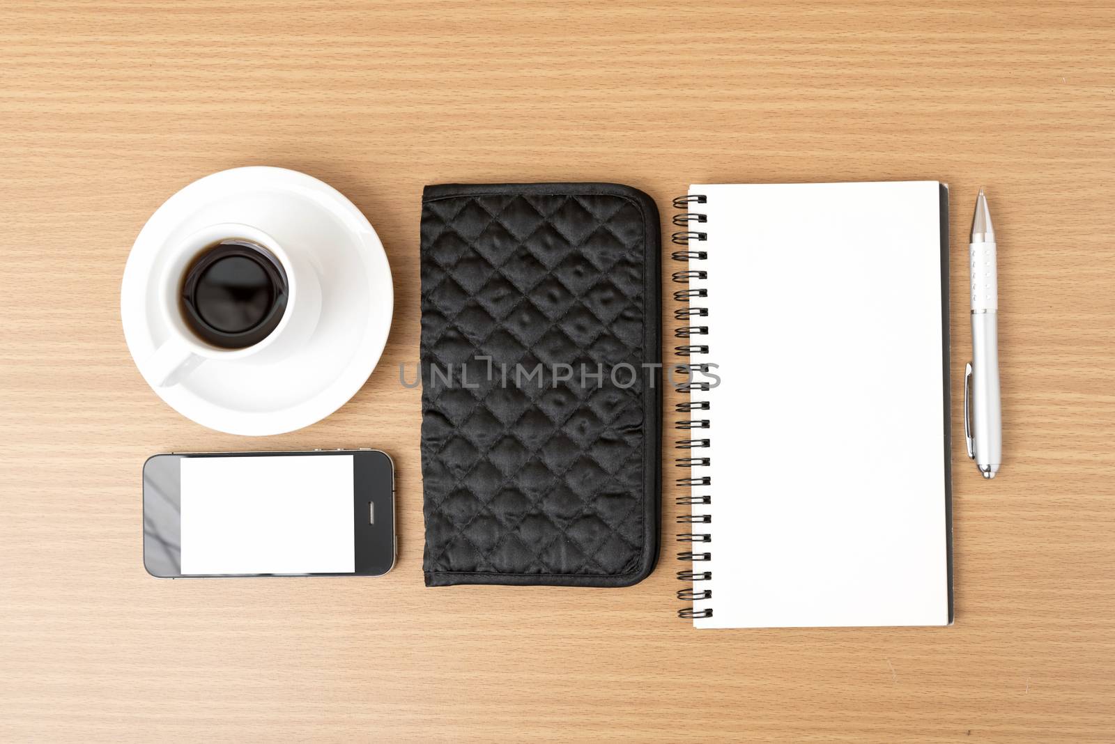 coffee,phone,notepad and wallet on wood table background