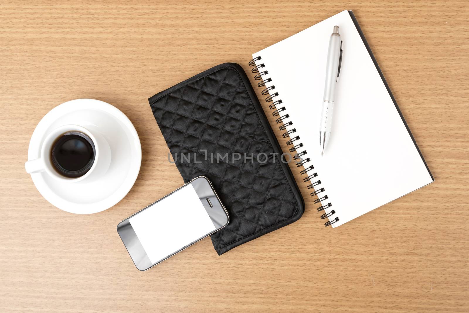 coffee,phone,notepad and wallet on wood table background
