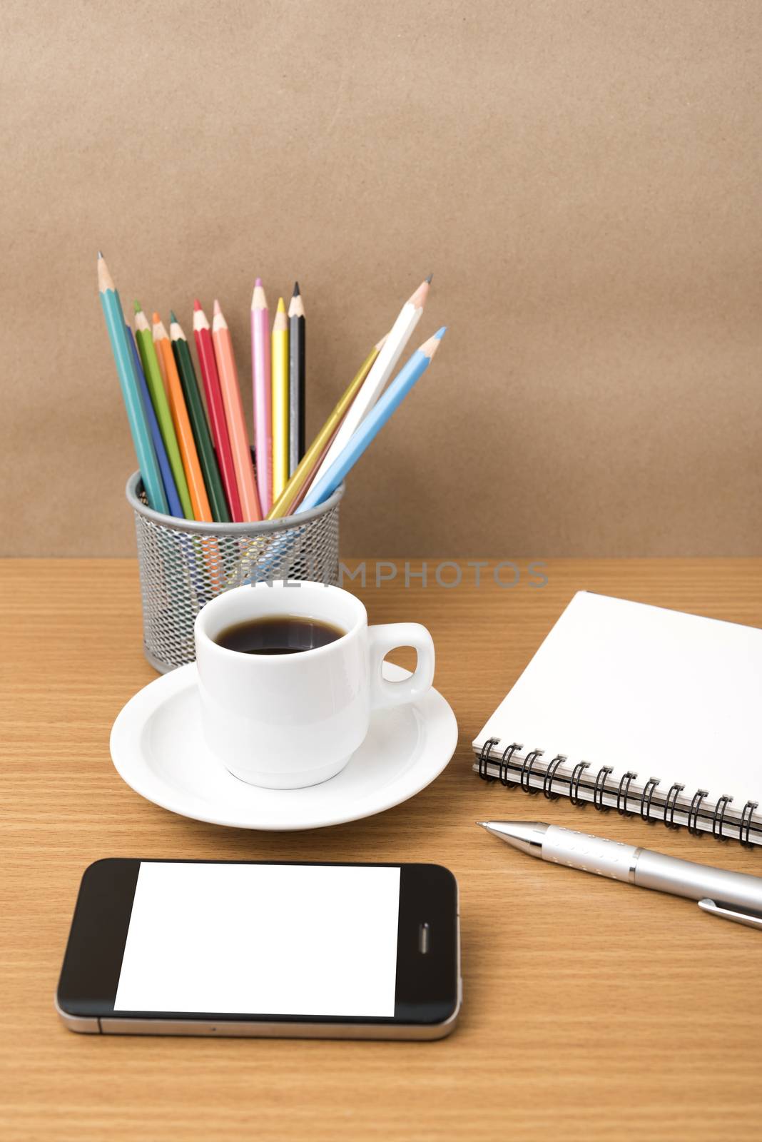 coffe,phone,notepad and color pencil on wood table background