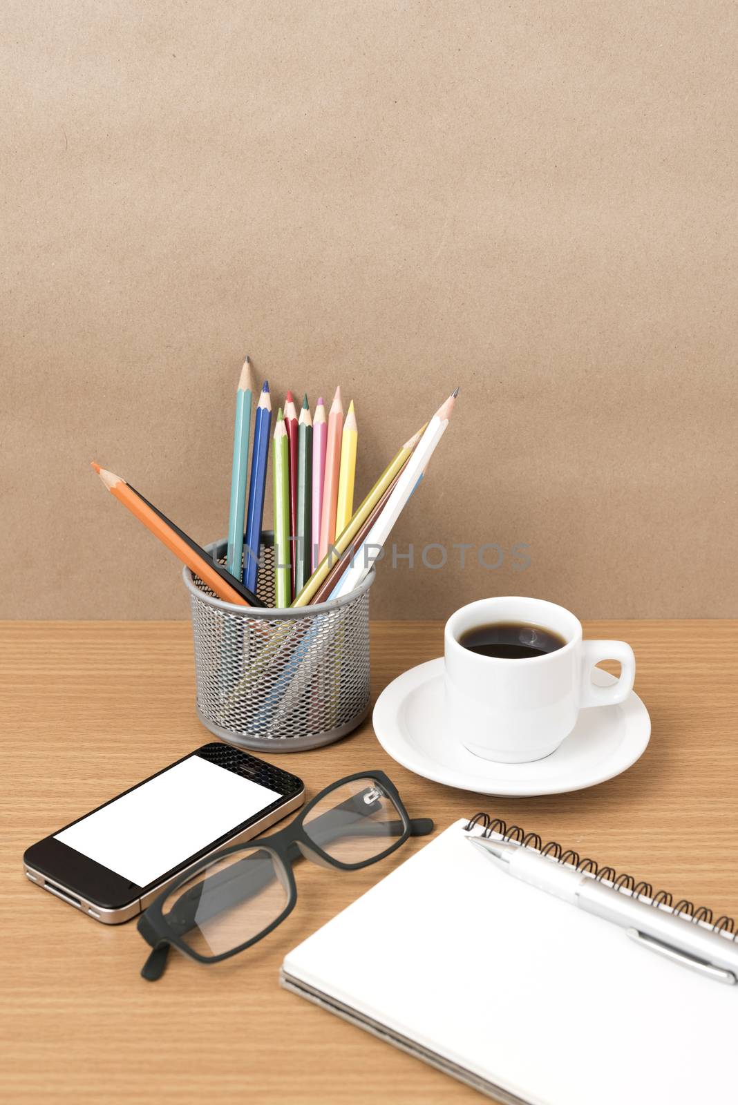 coffee,phone,eyeglasses,notepad and color pencil on wood table background