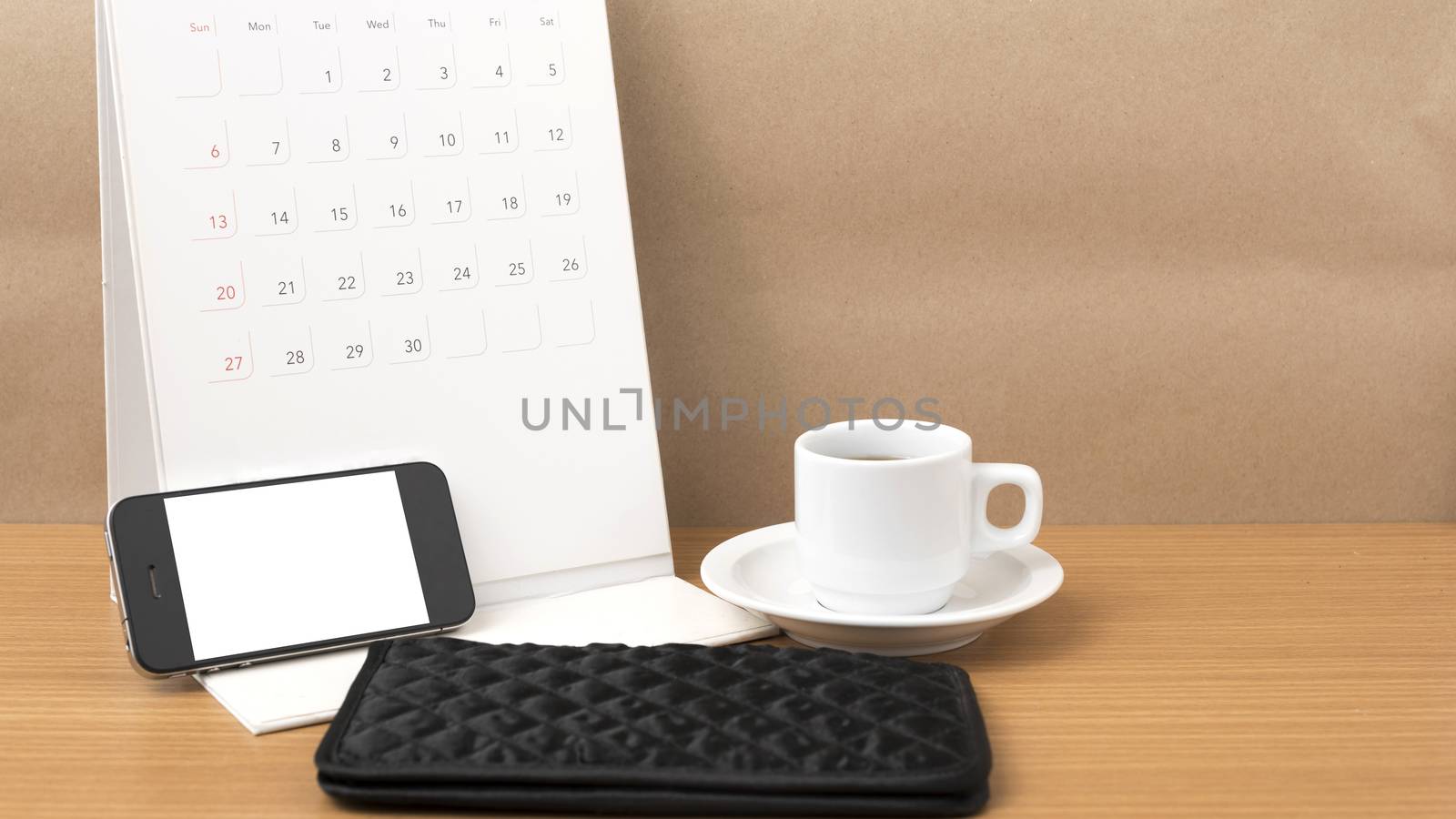 coffee,phone,wallet and canlendar on wood table background