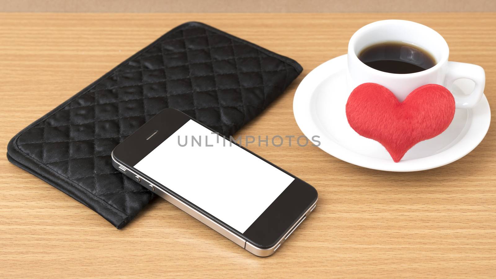 coffee,phone,wallet and heart on wood table background