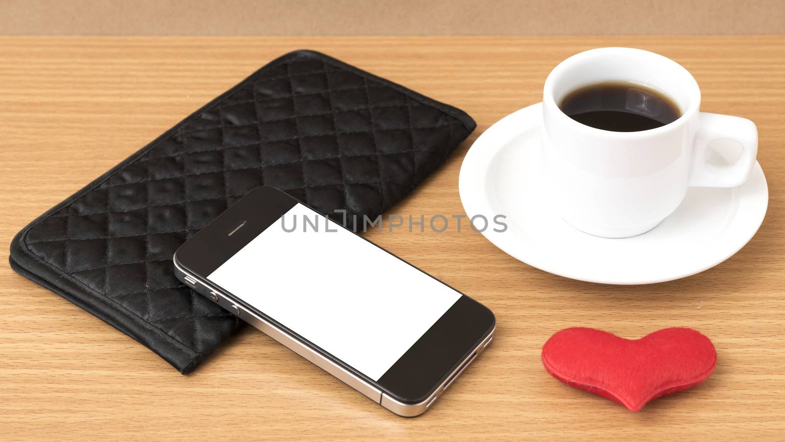 coffee,phone,wallet and heart on wood table background