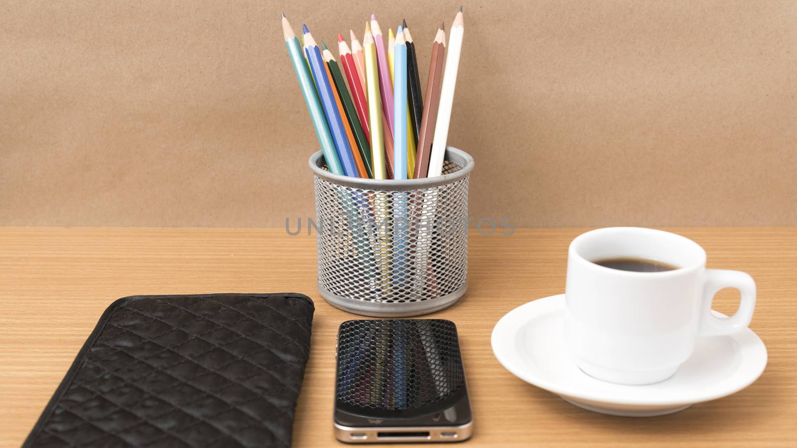 coffee,phone,wallet and color pencil on wood table background