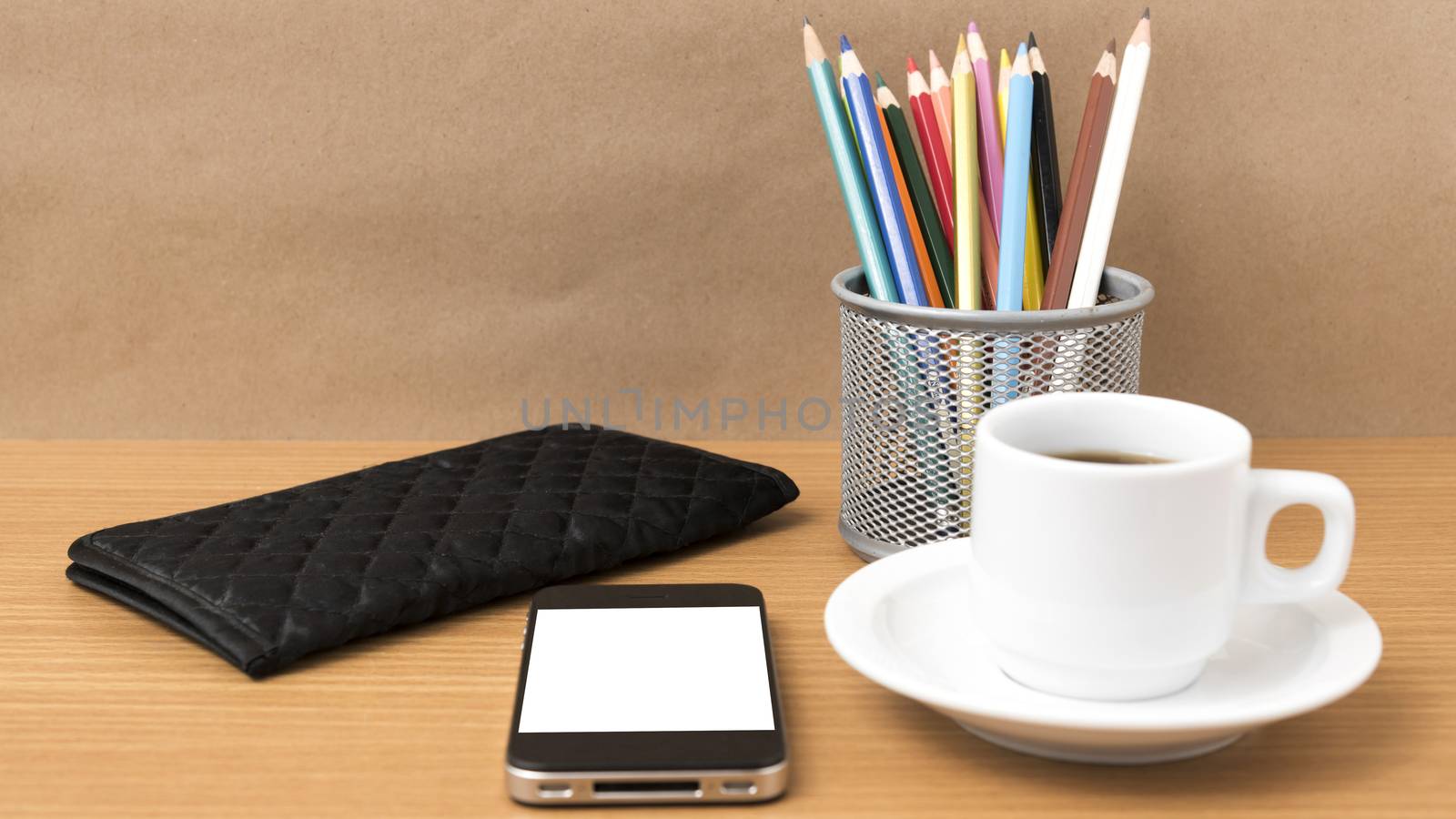 coffee,phone,wallet and color pencil on wood table background