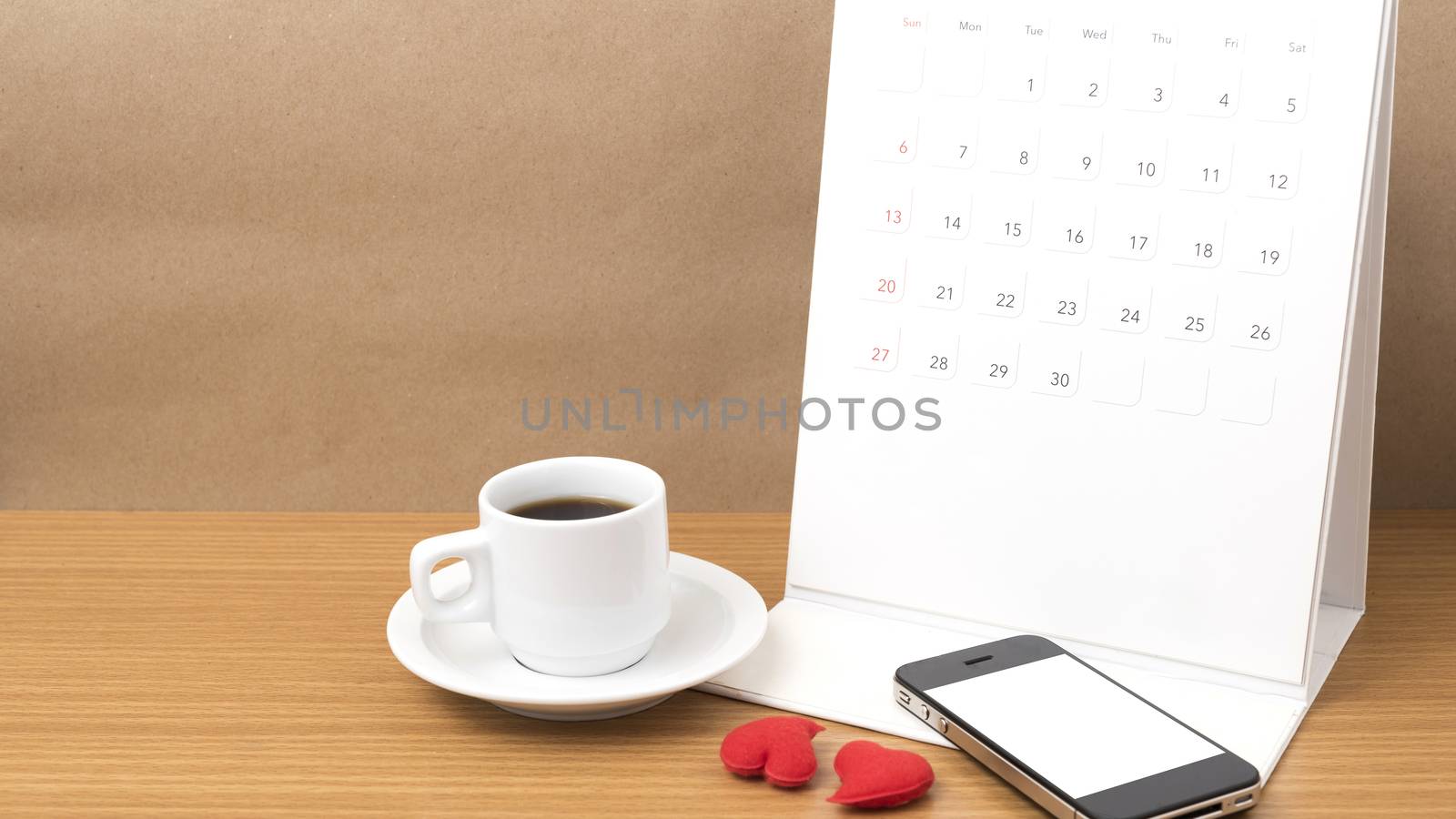 coffee,phone,calendar and heart on wood table background