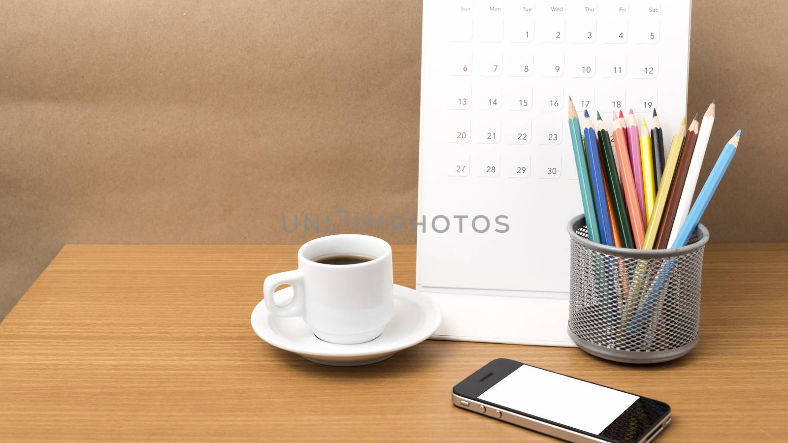 coffee,phone,calendar and color pencil on wood table background