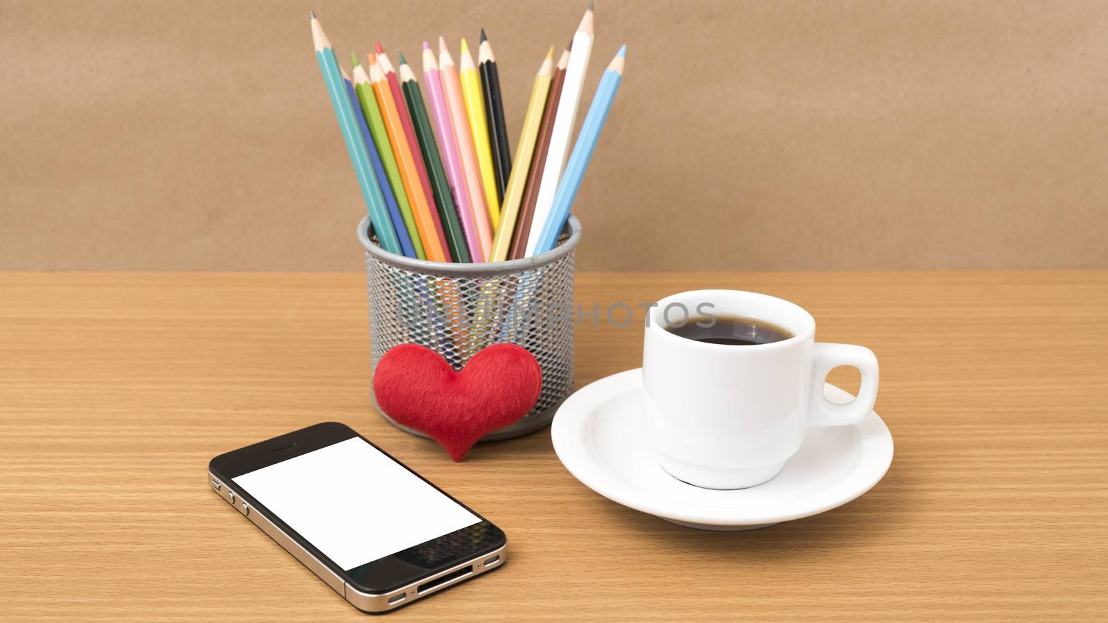 coffee,phone,color pencil and heart on wood table background