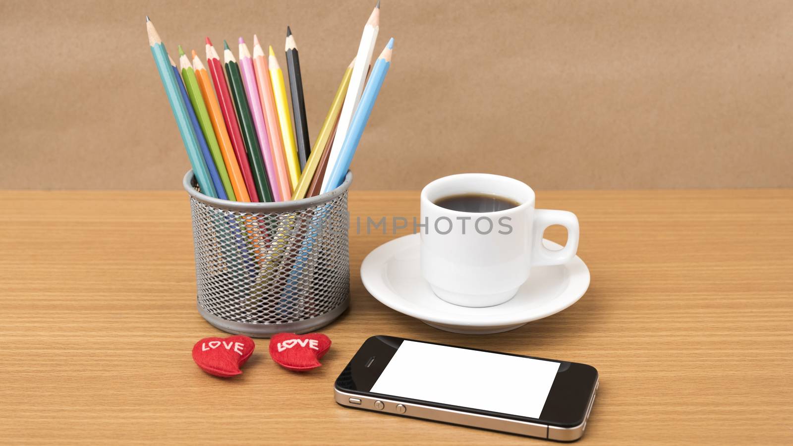 coffee,phone,color pencil and heart on wood table background