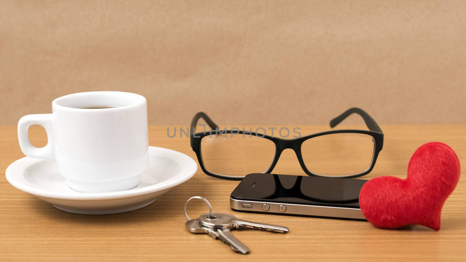 coffee,phone,eyeglasses and key on wood table background