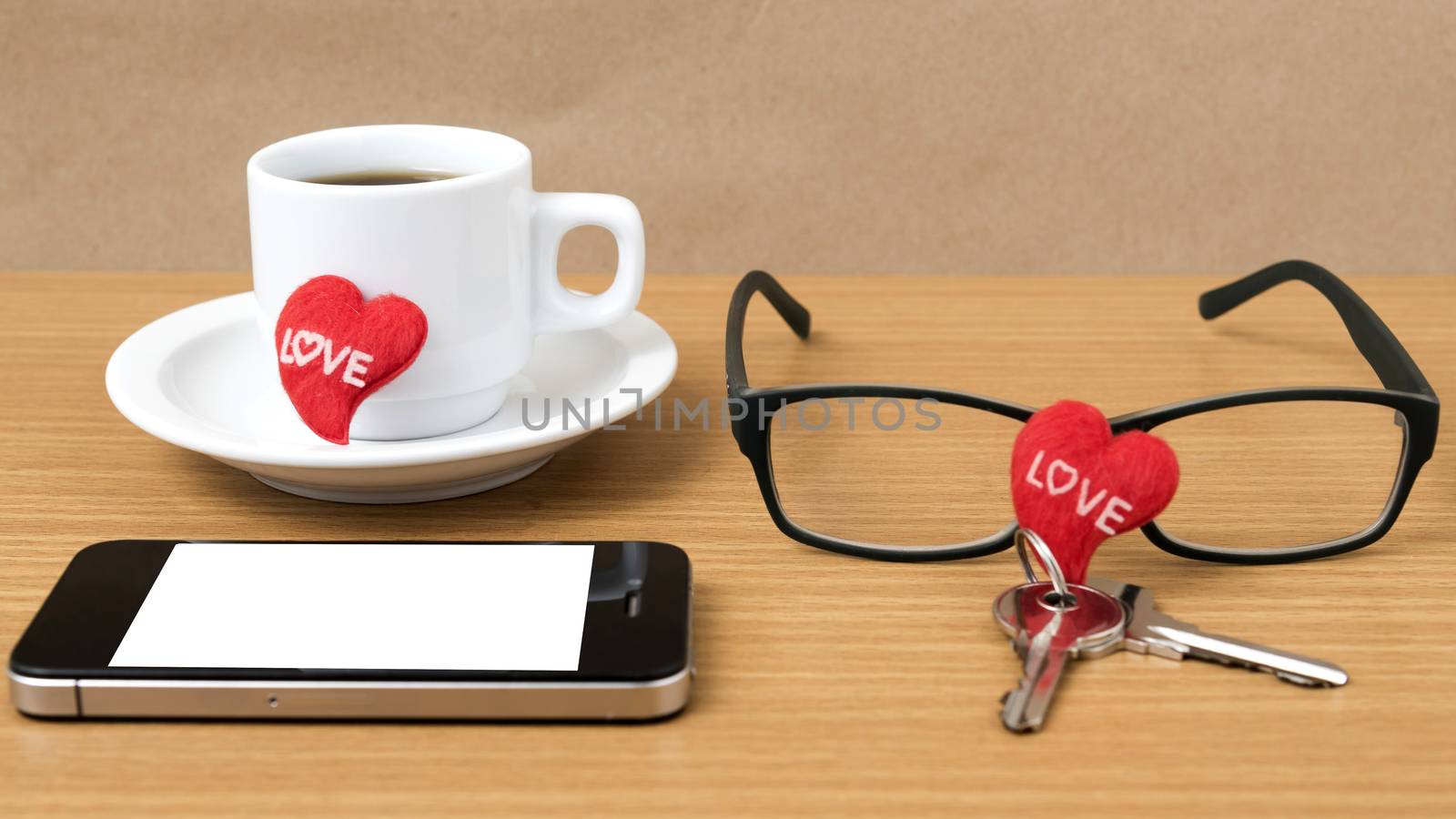 coffee,phone,eyeglasses and key on wood table background