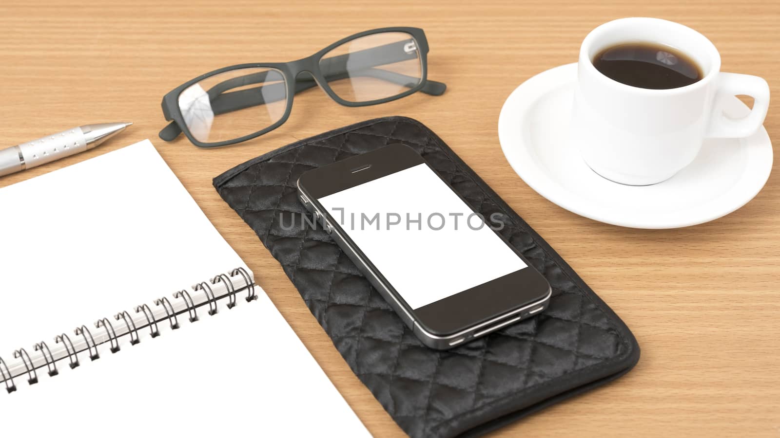 coffee,phone,eyeglasses,notepad and wallet on wood table background