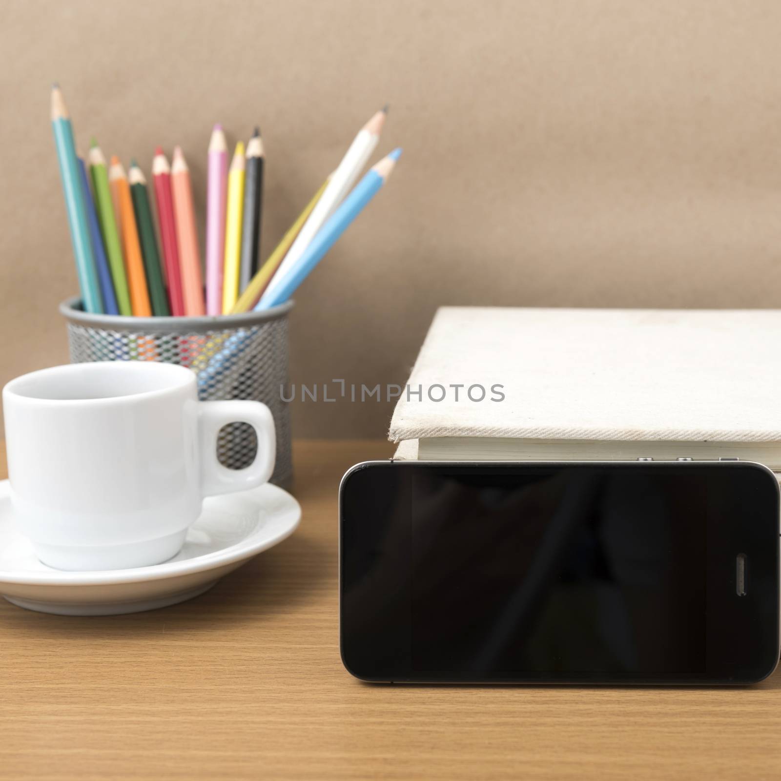 coffee,phone,stack of book and color pencil on wood table background