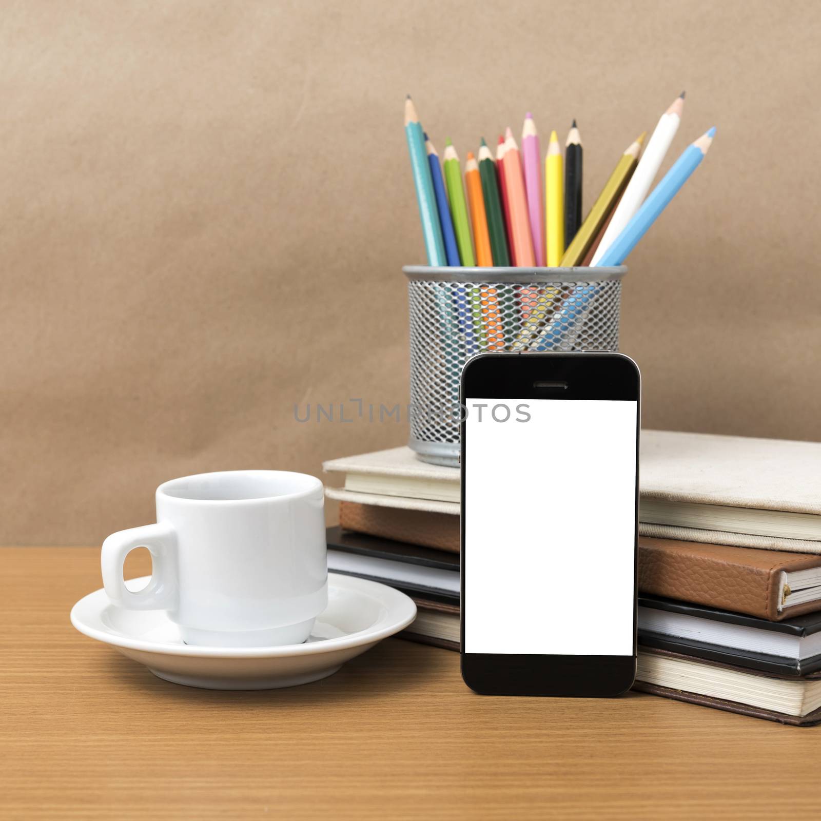 coffee,phone,stack of book and color pencil on wood table background