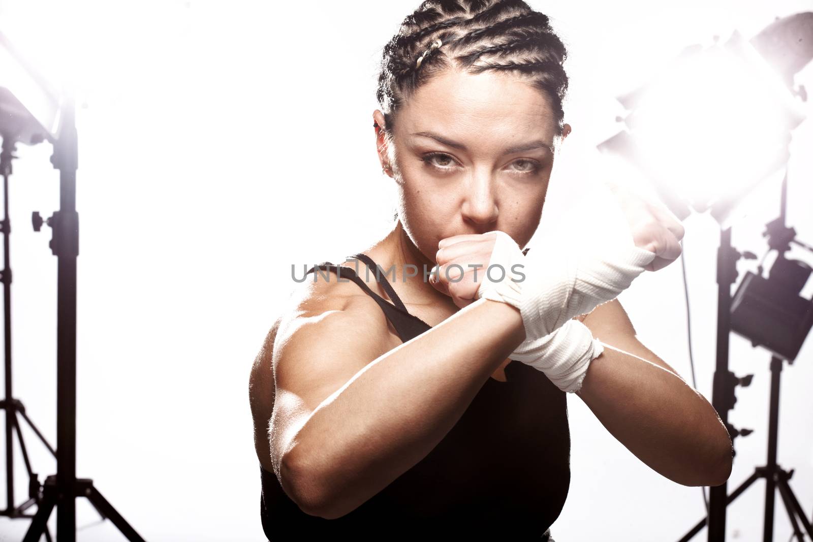 girl with a boxing pose in a studio