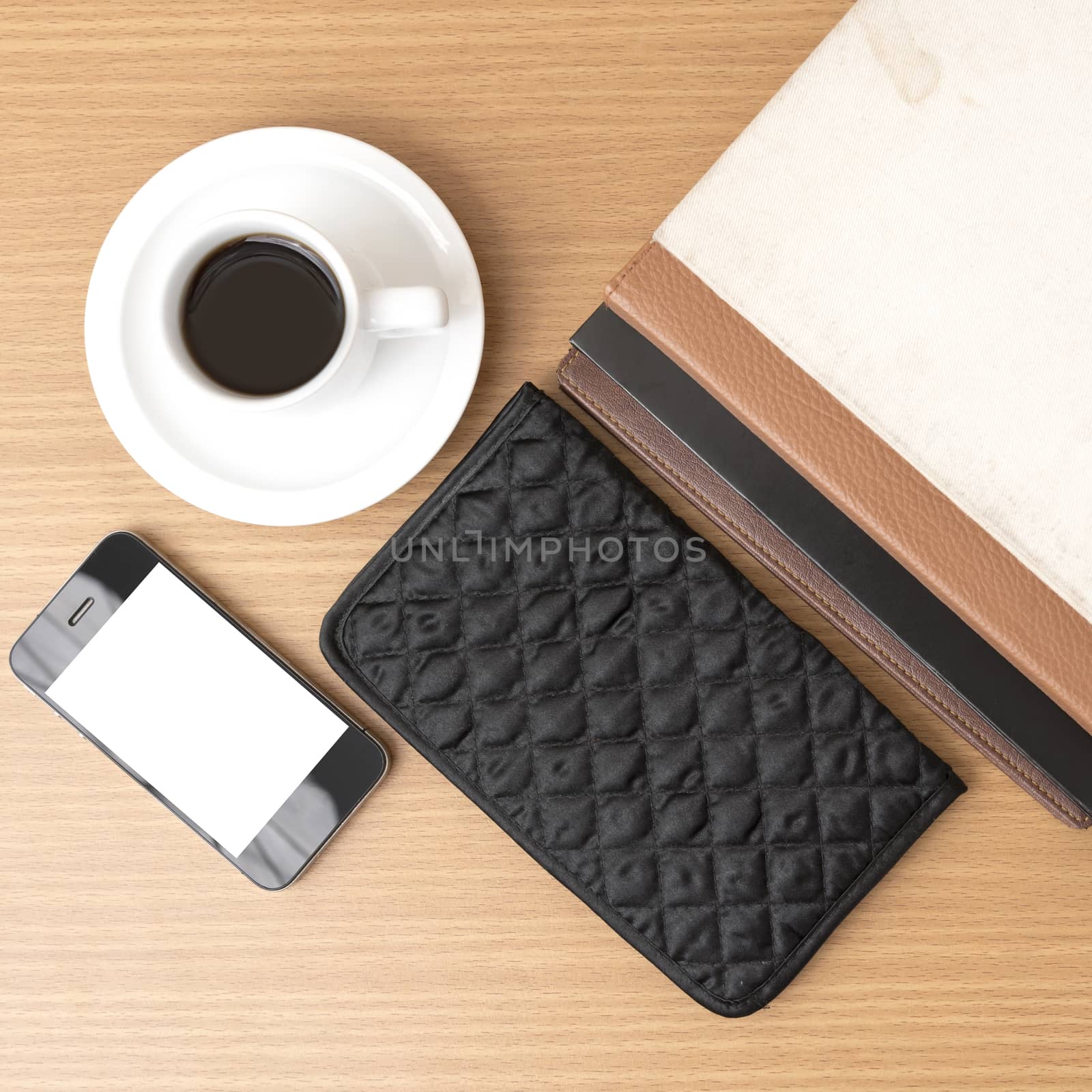 coffee,phone,stack of book and wallet on wood table background