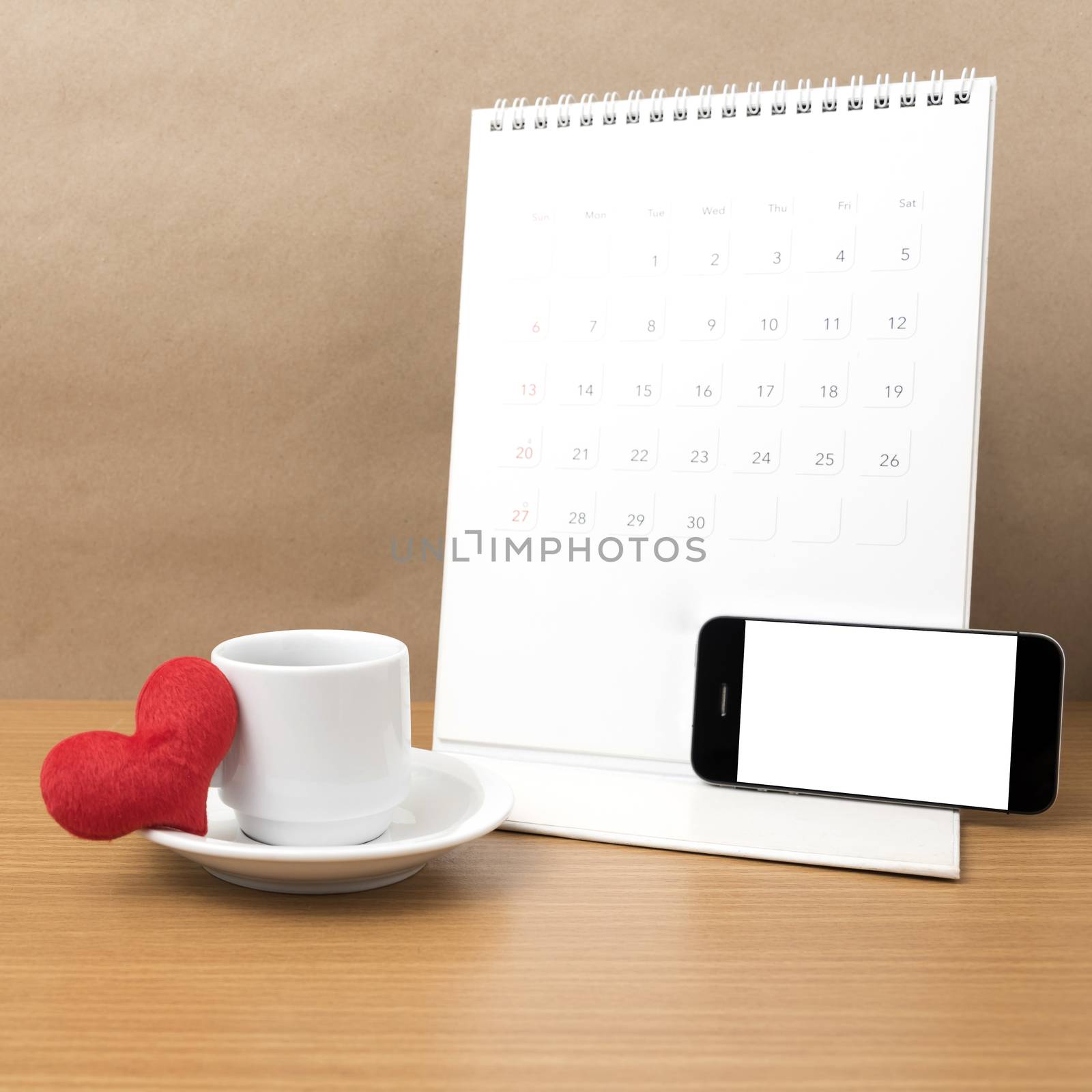 coffee,phone,calendar and heart on wood table background