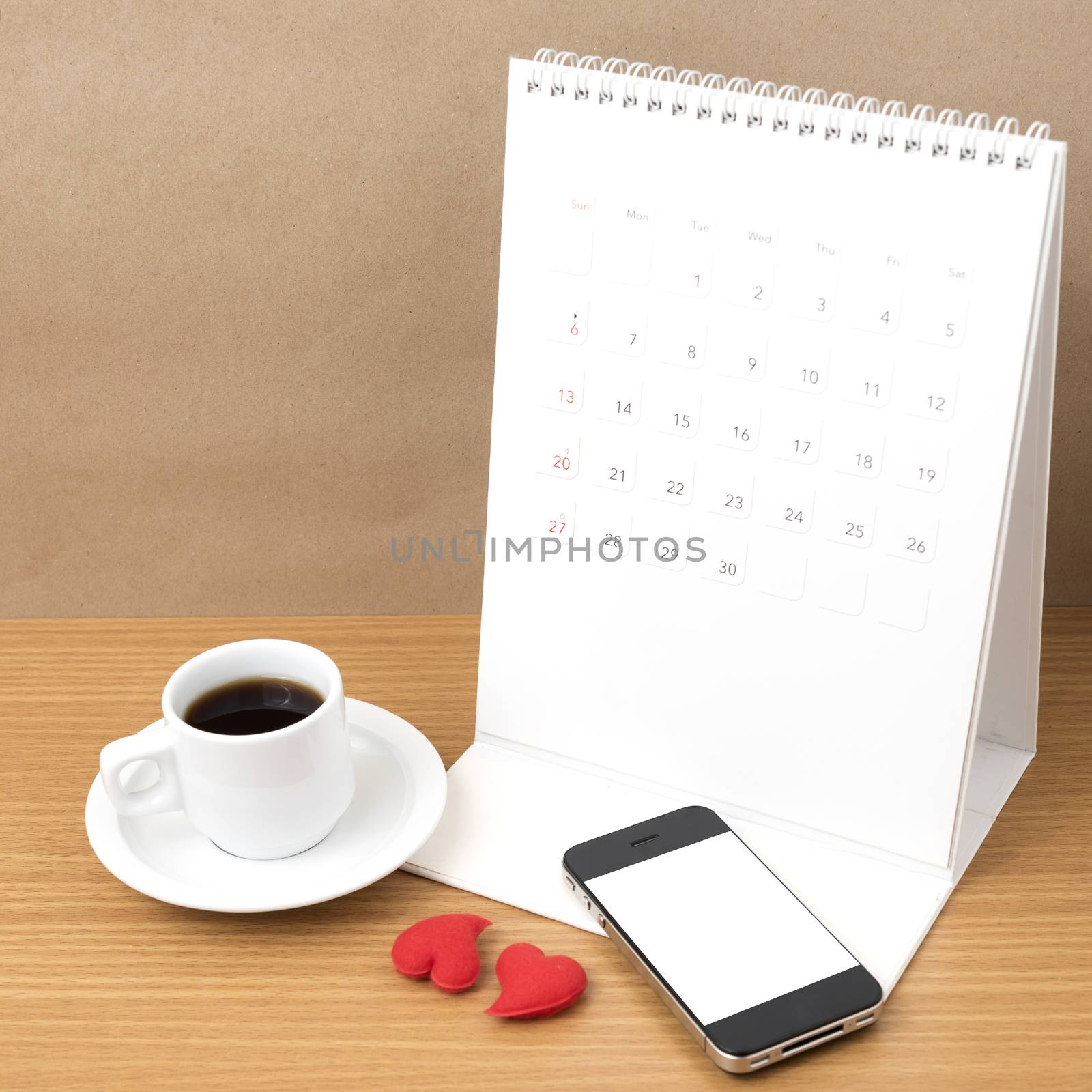 coffee,phone,calendar and heart on wood table background