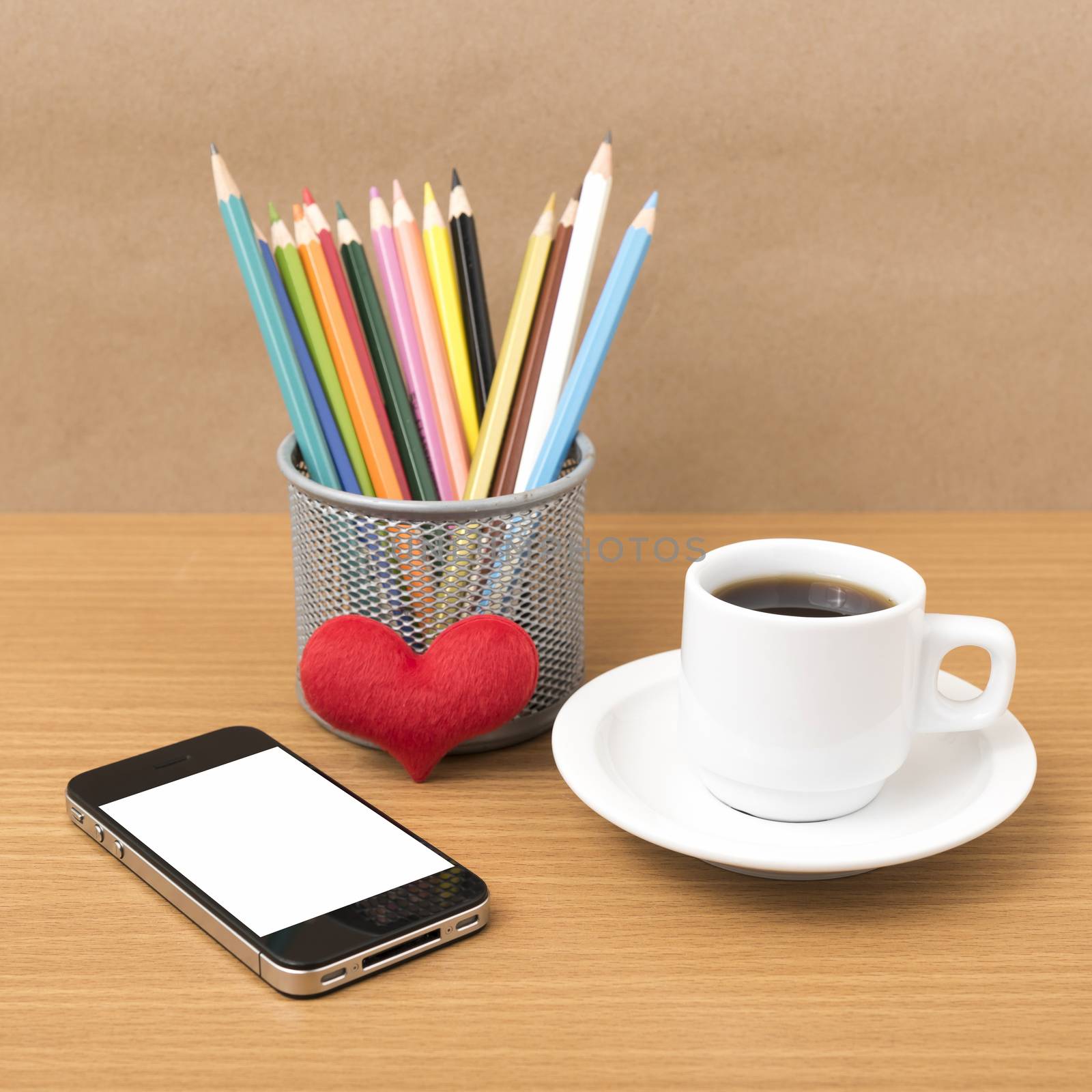 coffee,phone,color pencil and heart on wood table background
