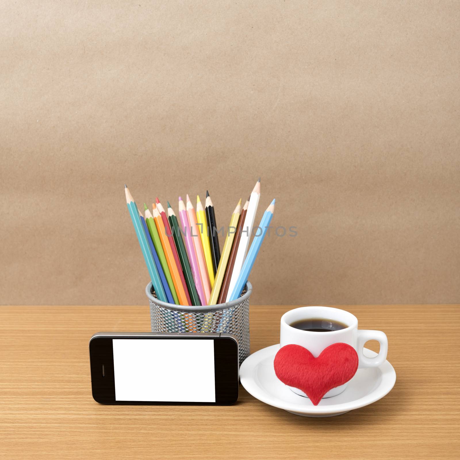 coffee,phone,color pencil and heart on wood table background