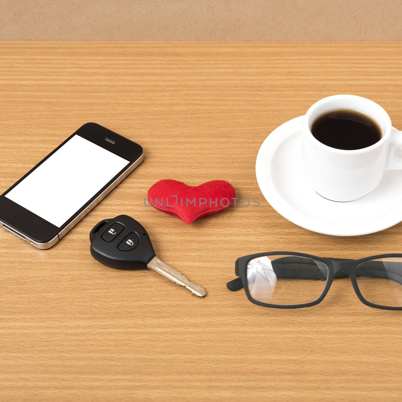 coffee,phone,eyeglasses and car key on wood table background