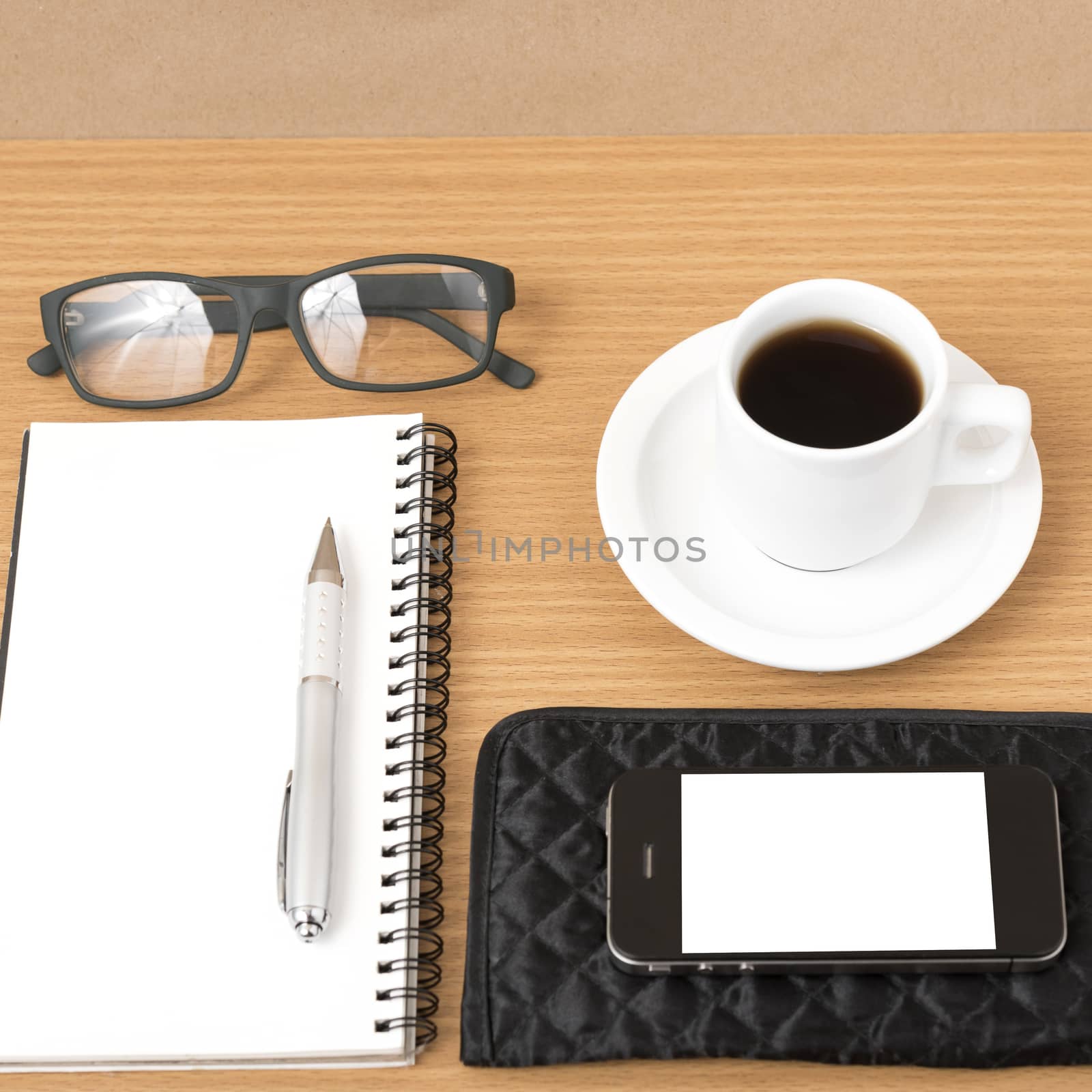 coffee,phone,eyeglasses,notepad and wallet on wood table background